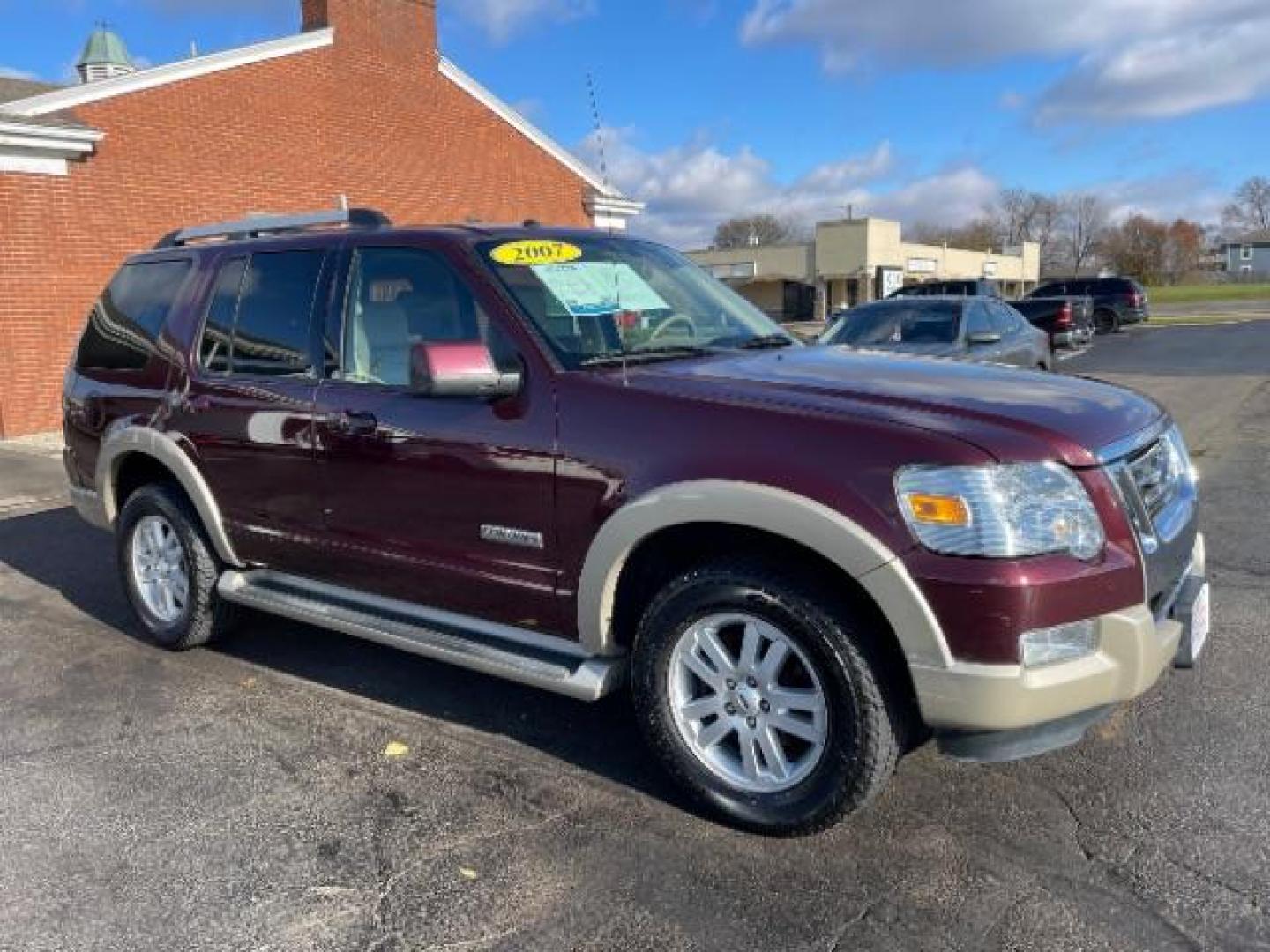 2007 Dark Cherry Metallic Ford Explorer Eddie Bauer 4.0L 4WD (1FMEU74E77U) with an 4.0L V6 SOHC 16V engine, 5-Speed Automatic transmission, located at 880 E. National Road, Vandalia, OH, 45377, (937) 908-9800, 39.892189, -84.181015 - Photo#0