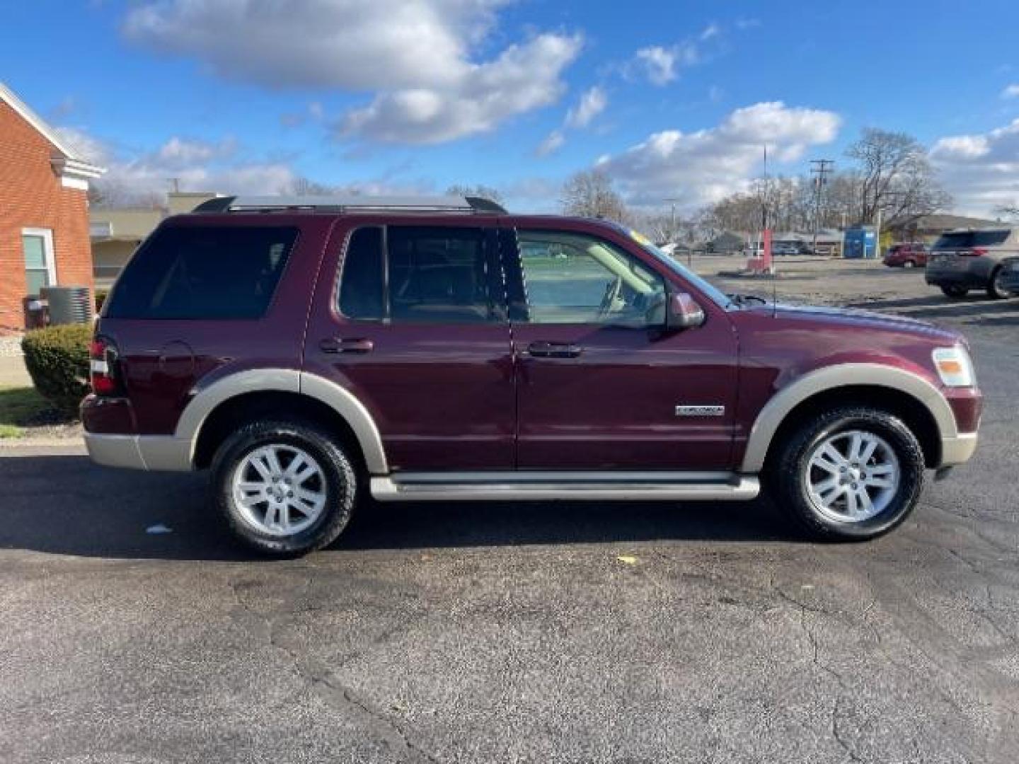 2007 Dark Cherry Metallic Ford Explorer Eddie Bauer 4.0L 4WD (1FMEU74E77U) with an 4.0L V6 SOHC 16V engine, 5-Speed Automatic transmission, located at 880 E. National Road, Vandalia, OH, 45377, (937) 908-9800, 39.892189, -84.181015 - Photo#4