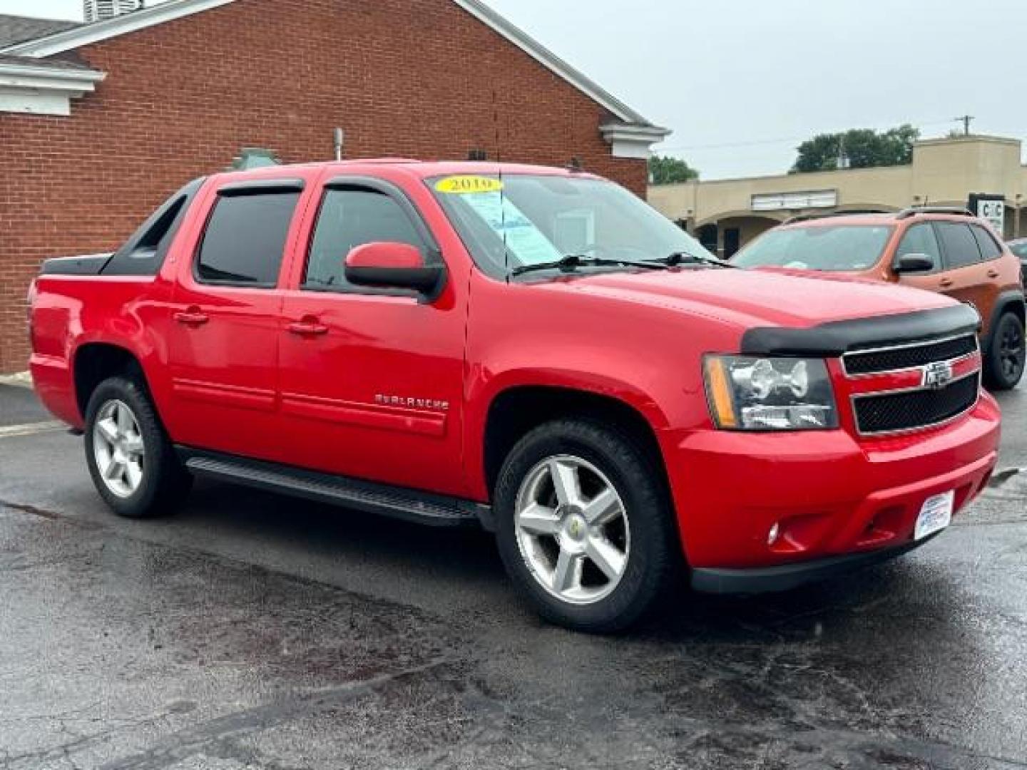 2010 Victory Red Chevrolet Avalanche LT 4WD (3GNVKFE09AG) with an 5.3L V8 OHV 16V FFV engine, 4-Speed Automatic transmission, located at 4508 South Dixie Dr, Moraine, OH, 45439, (937) 908-9800, 39.690136, -84.216438 - Photo#0