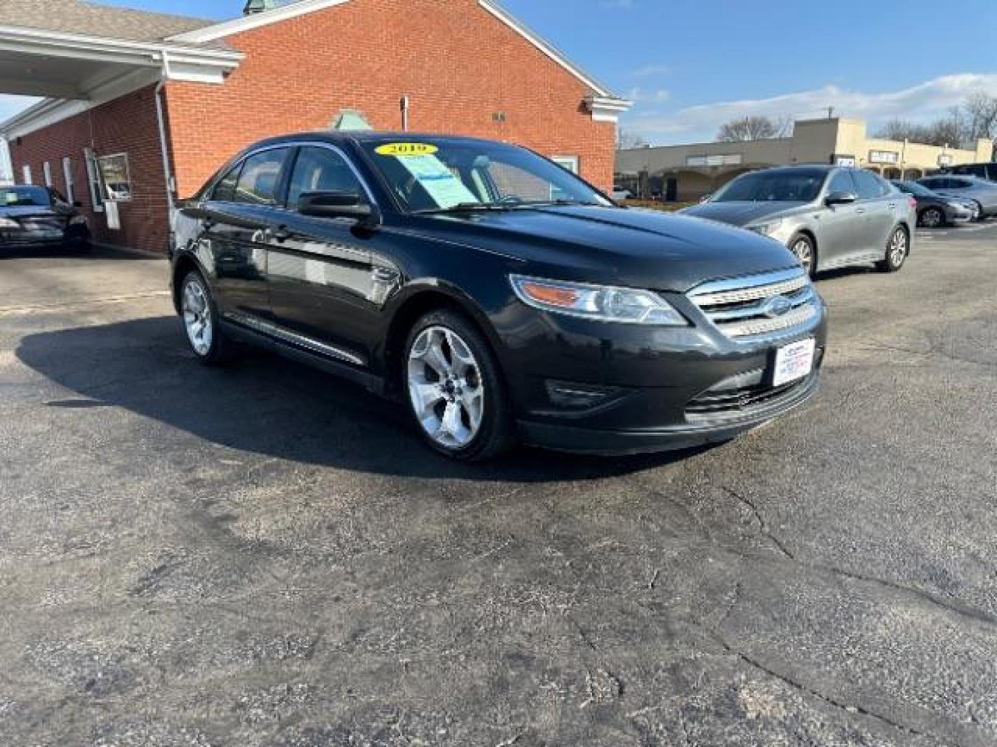 2010 Tuxedo Black Metallic Ford Taurus SEL FWD (1FAHP2EW5AG) with an 3.5L V6 DOHC 24V engine, 6-Speed Automatic transmission, located at 1184 Kauffman Ave, Fairborn, OH, 45324, (937) 908-9800, 39.807365, -84.029114 - Photo#0