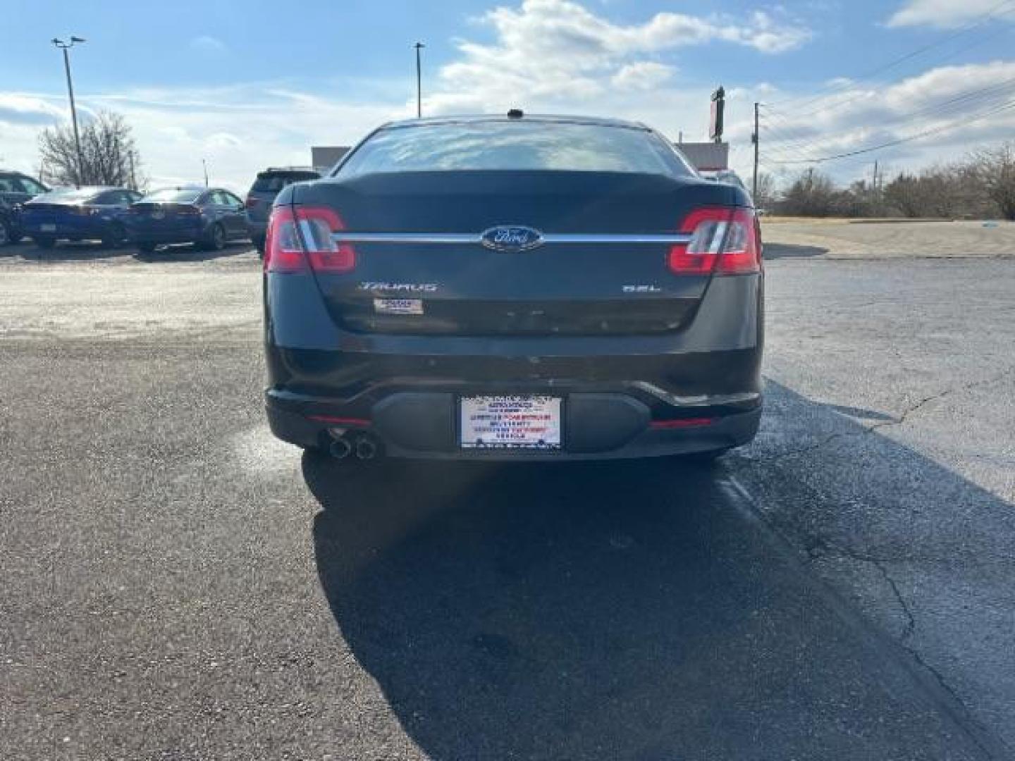 2010 Tuxedo Black Metallic Ford Taurus SEL FWD (1FAHP2EW5AG) with an 3.5L V6 DOHC 24V engine, 6-Speed Automatic transmission, located at 1184 Kauffman Ave, Fairborn, OH, 45324, (937) 908-9800, 39.807365, -84.029114 - Photo#4