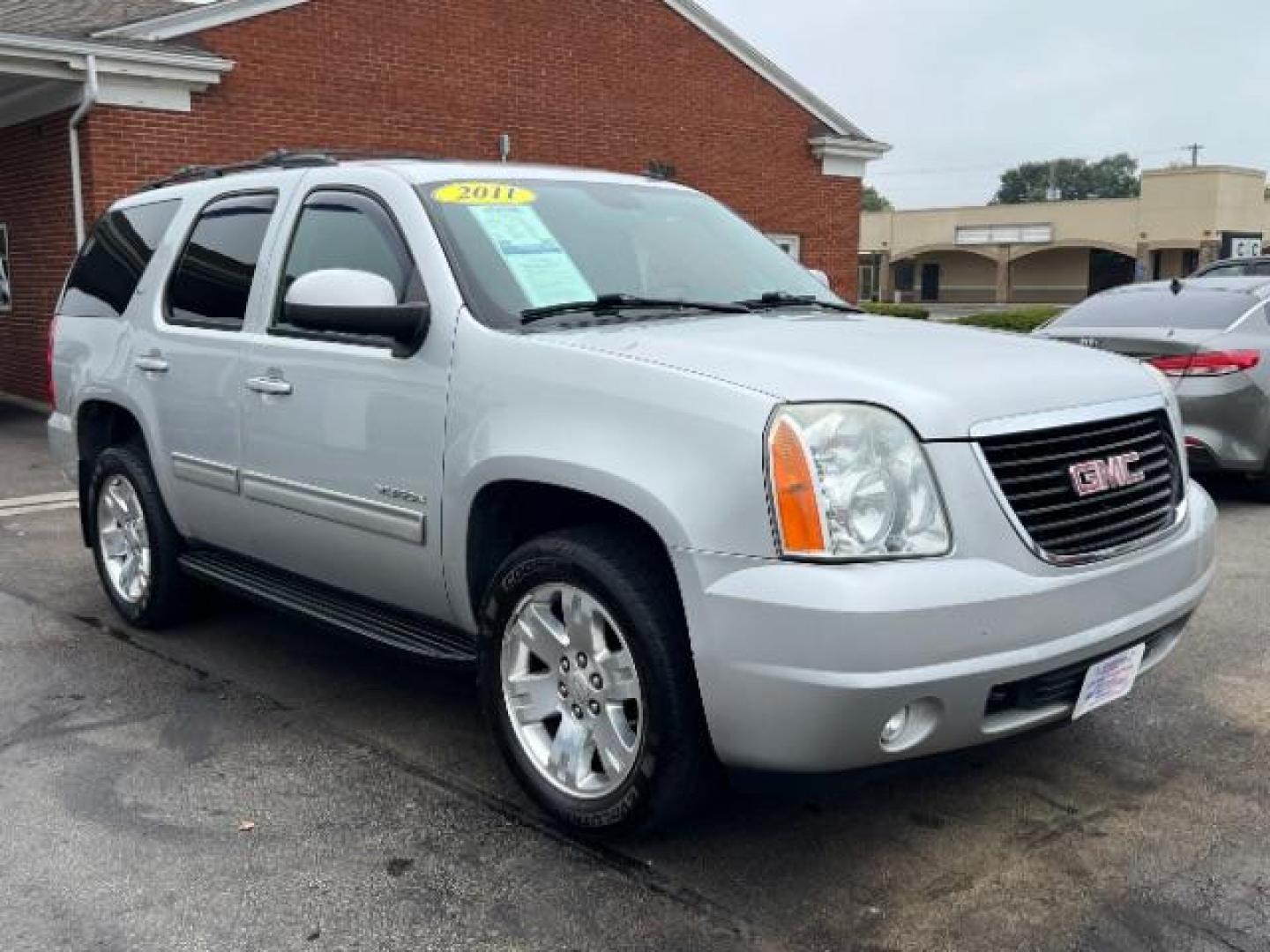 2011 Pure Silver Metallic GMC Yukon SLT1 4WD (1GKS2CE0XBR) with an 5.3L V8 OHV 16V FFV engine, 6-Speed Automatic transmission, located at 401 Woodman Dr, Riverside, OH, 45431, (937) 908-9800, 39.763779, -84.122063 - Third Row - Photo#0