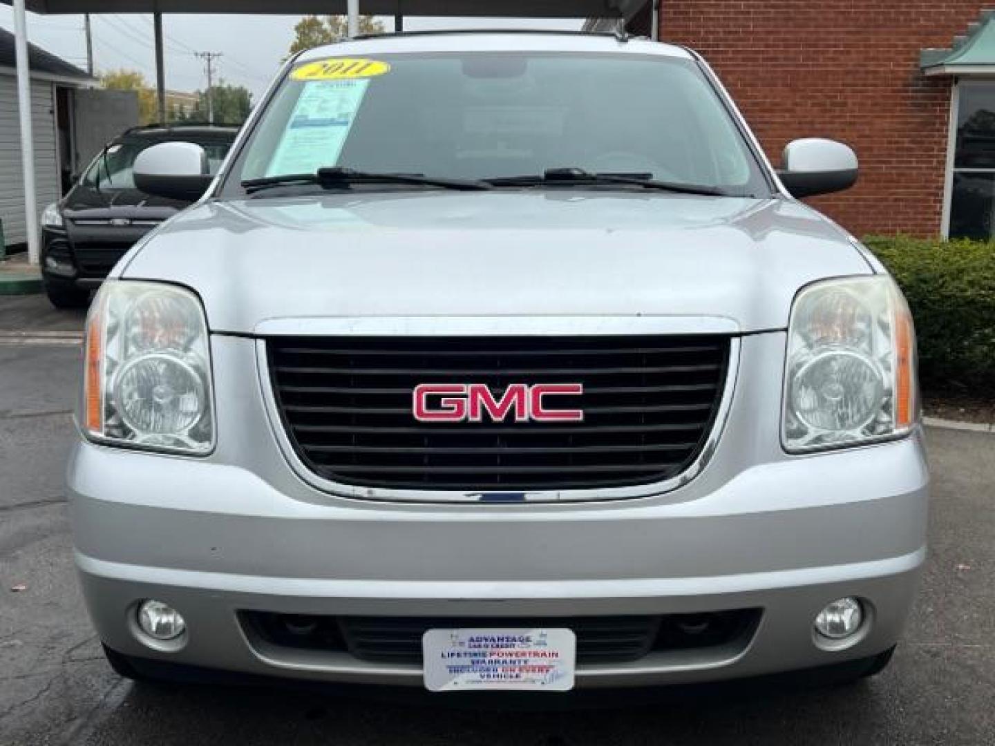 2011 Pure Silver Metallic GMC Yukon SLT1 4WD (1GKS2CE0XBR) with an 5.3L V8 OHV 16V FFV engine, 6-Speed Automatic transmission, located at 401 Woodman Dr, Riverside, OH, 45431, (937) 908-9800, 39.763779, -84.122063 - Third Row - Photo#1