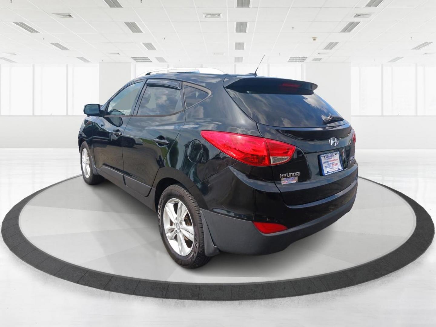 2011 Ash Black Mica Hyundai Tucson (KM8JU3AC8BU) with an 2.4L L4 DOHC 16V engine, 6-Speed Automatic transmission, located at 1184 Kauffman Ave, Fairborn, OH, 45324, (937) 908-9800, 39.807365, -84.029114 - Photo#4