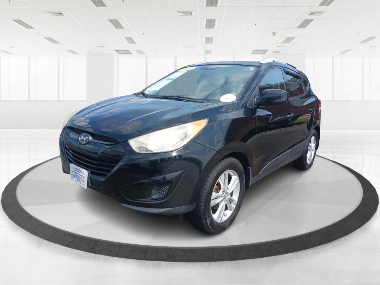 2011 Ash Black Mica Hyundai Tucson (KM8JU3AC8BU) with an 2.4L L4 DOHC 16V engine, 6-Speed Automatic transmission, located at 1184 Kauffman Ave, Fairborn, OH, 45324, (937) 908-9800, 39.807365, -84.029114 - Photo#5