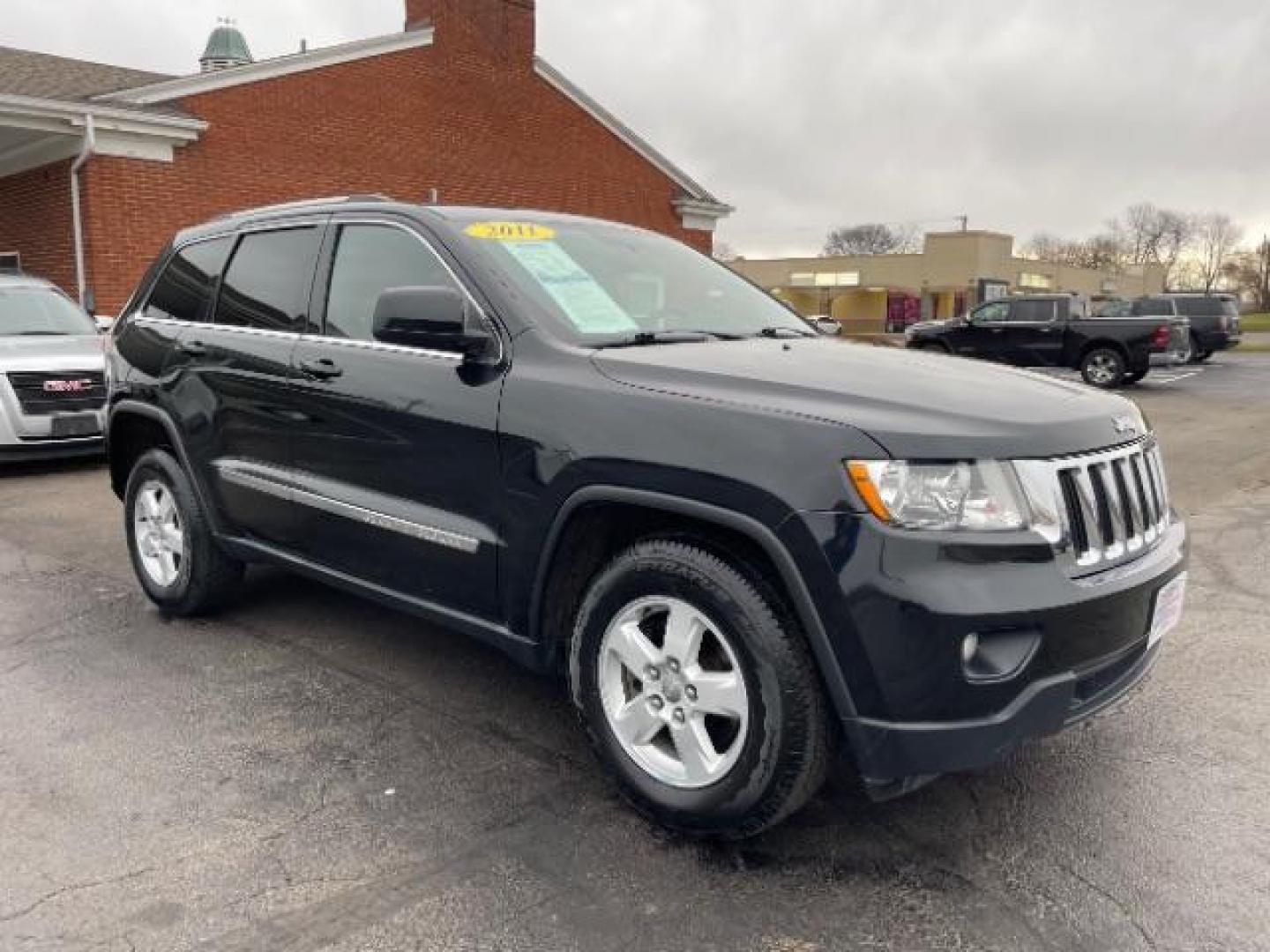 2011 Brilliant Black Crystal Pearl Jeep Grand Cherokee Laredo 4WD (1J4RR4GG4BC) with an 3.6L V6 DOHC 24V engine, 5-Speed Automatic transmission, located at 4508 South Dixie Dr, Moraine, OH, 45439, (937) 908-9800, 39.690136, -84.216438 - Photo#0