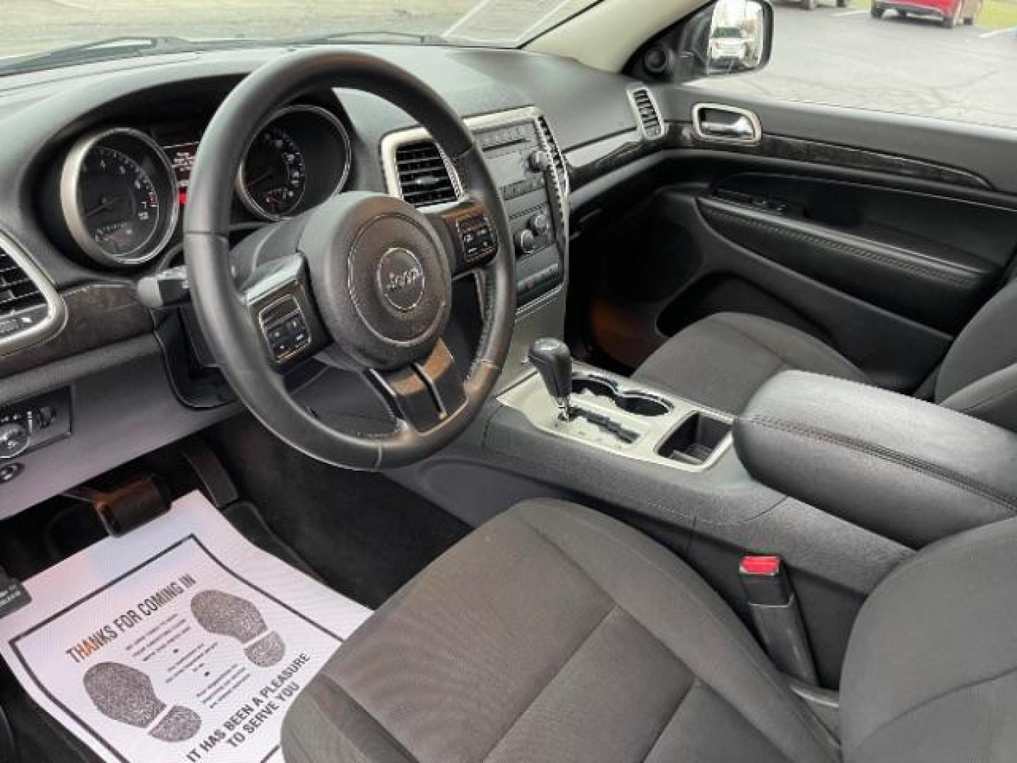 2011 Brilliant Black Crystal Pearl Jeep Grand Cherokee Laredo 4WD (1J4RR4GG4BC) with an 3.6L V6 DOHC 24V engine, 5-Speed Automatic transmission, located at 4508 South Dixie Dr, Moraine, OH, 45439, (937) 908-9800, 39.690136, -84.216438 - Photo#6