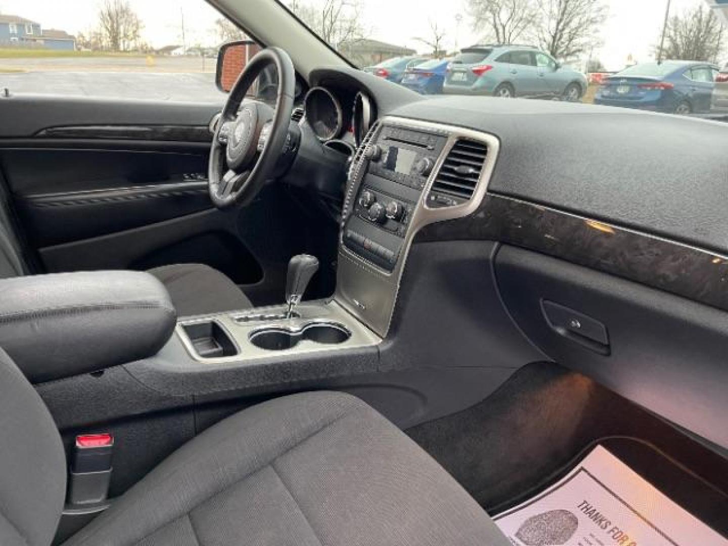 2011 Brilliant Black Crystal Pearl Jeep Grand Cherokee Laredo 4WD (1J4RR4GG4BC) with an 3.6L V6 DOHC 24V engine, 5-Speed Automatic transmission, located at 4508 South Dixie Dr, Moraine, OH, 45439, (937) 908-9800, 39.690136, -84.216438 - Photo#7