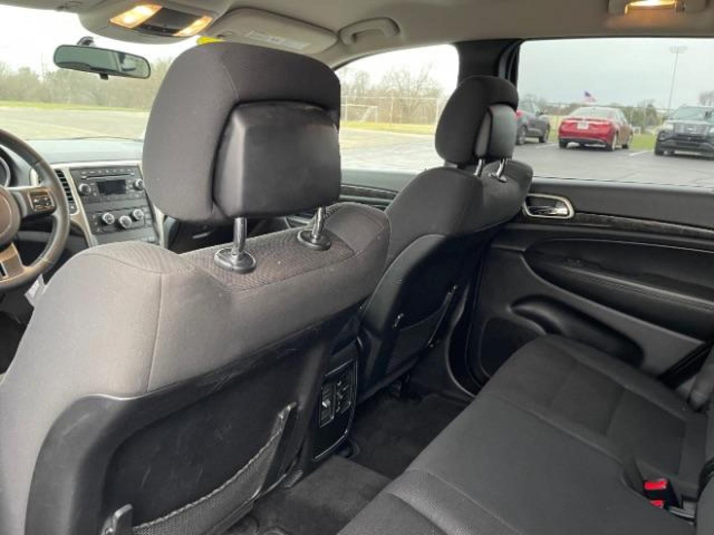 2011 Brilliant Black Crystal Pearl Jeep Grand Cherokee Laredo 4WD (1J4RR4GG4BC) with an 3.6L V6 DOHC 24V engine, 5-Speed Automatic transmission, located at 4508 South Dixie Dr, Moraine, OH, 45439, (937) 908-9800, 39.690136, -84.216438 - Photo#8