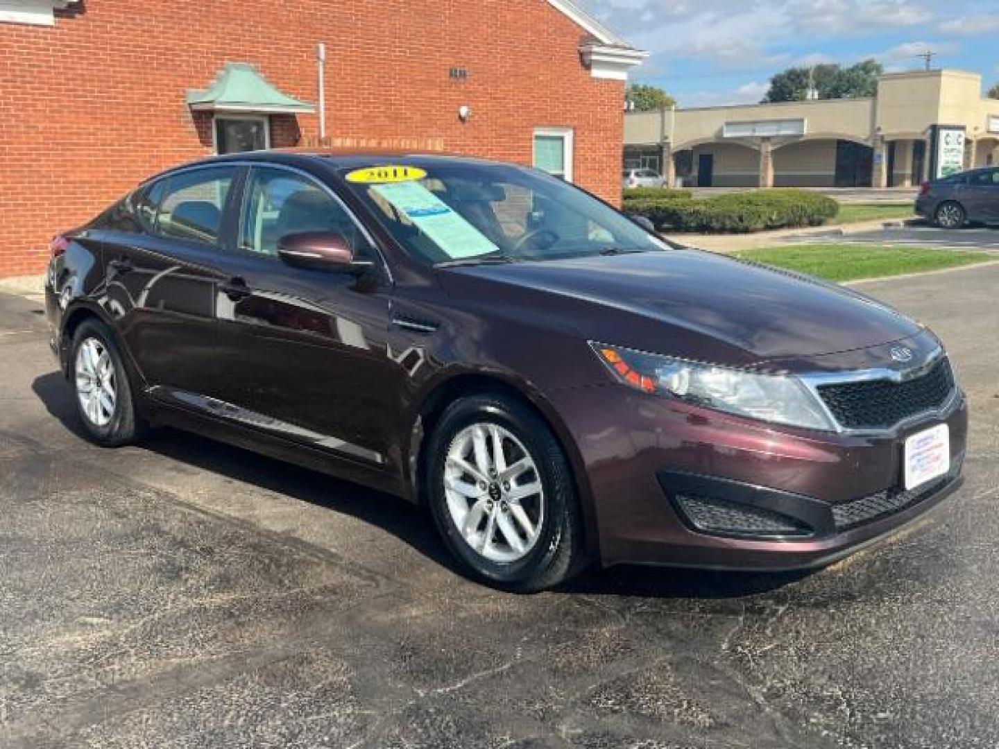 2011 Dark Cherry Kia Optima LX AT (KNAGM4A72B5) with an 2.4L L4 DOHC 16V engine, 6-Speed Automatic transmission, located at 1099 N County Rd 25A, OH, 45373, (937) 908-9800, 40.057079, -84.212883 - Photo#0