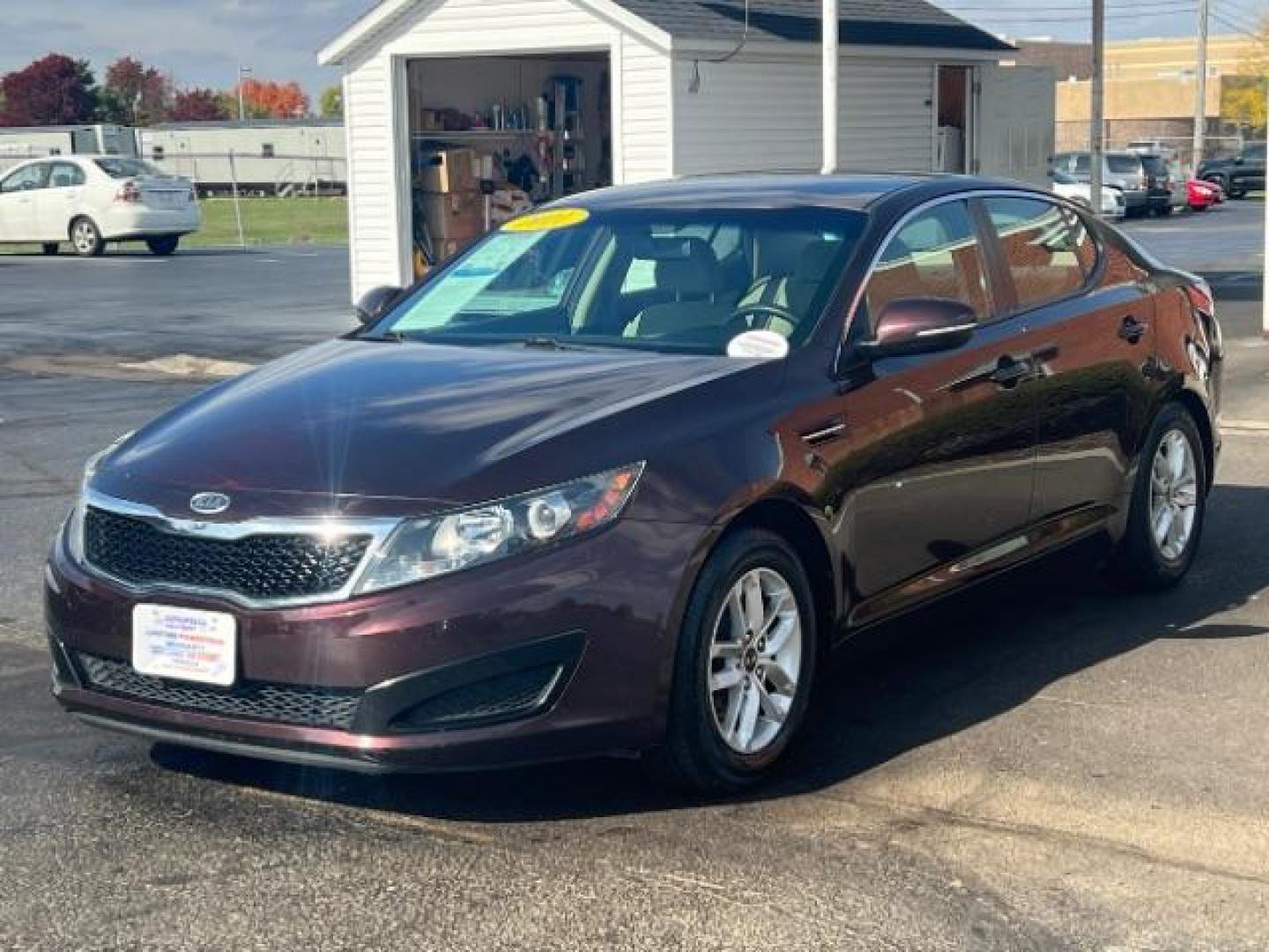 2011 Dark Cherry Kia Optima LX AT (KNAGM4A72B5) with an 2.4L L4 DOHC 16V engine, 6-Speed Automatic transmission, located at 1099 N County Rd 25A, OH, 45373, (937) 908-9800, 40.057079, -84.212883 - Photo#1