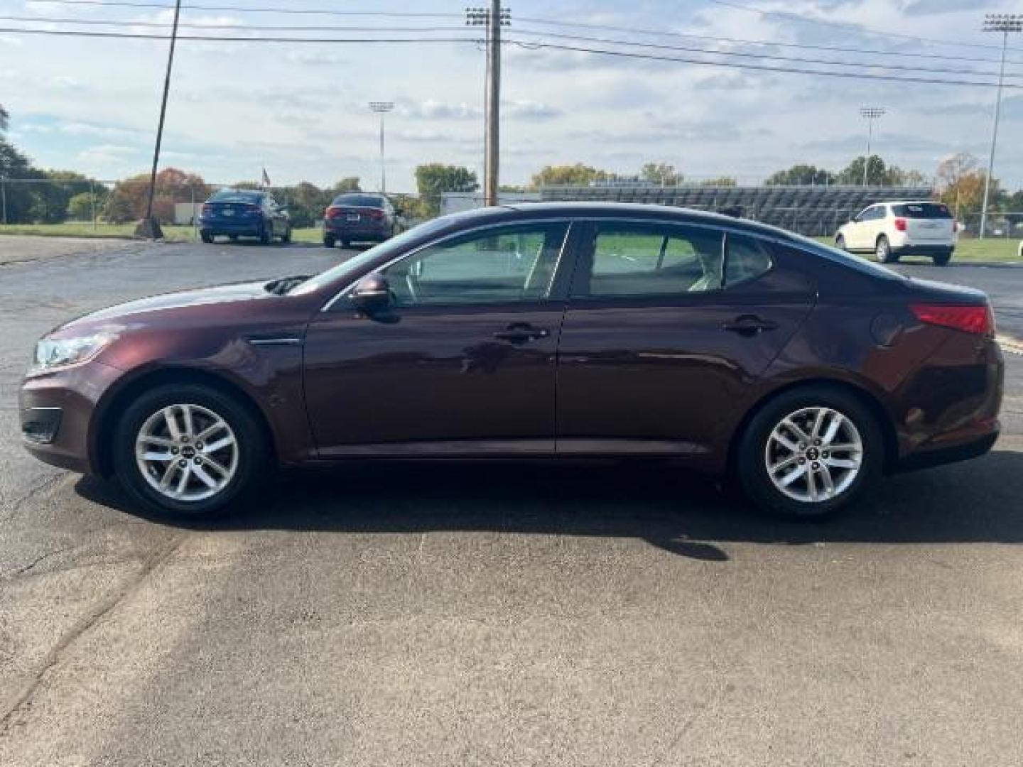 2011 Dark Cherry Kia Optima LX AT (KNAGM4A72B5) with an 2.4L L4 DOHC 16V engine, 6-Speed Automatic transmission, located at 1099 N County Rd 25A, OH, 45373, (937) 908-9800, 40.057079, -84.212883 - Photo#3