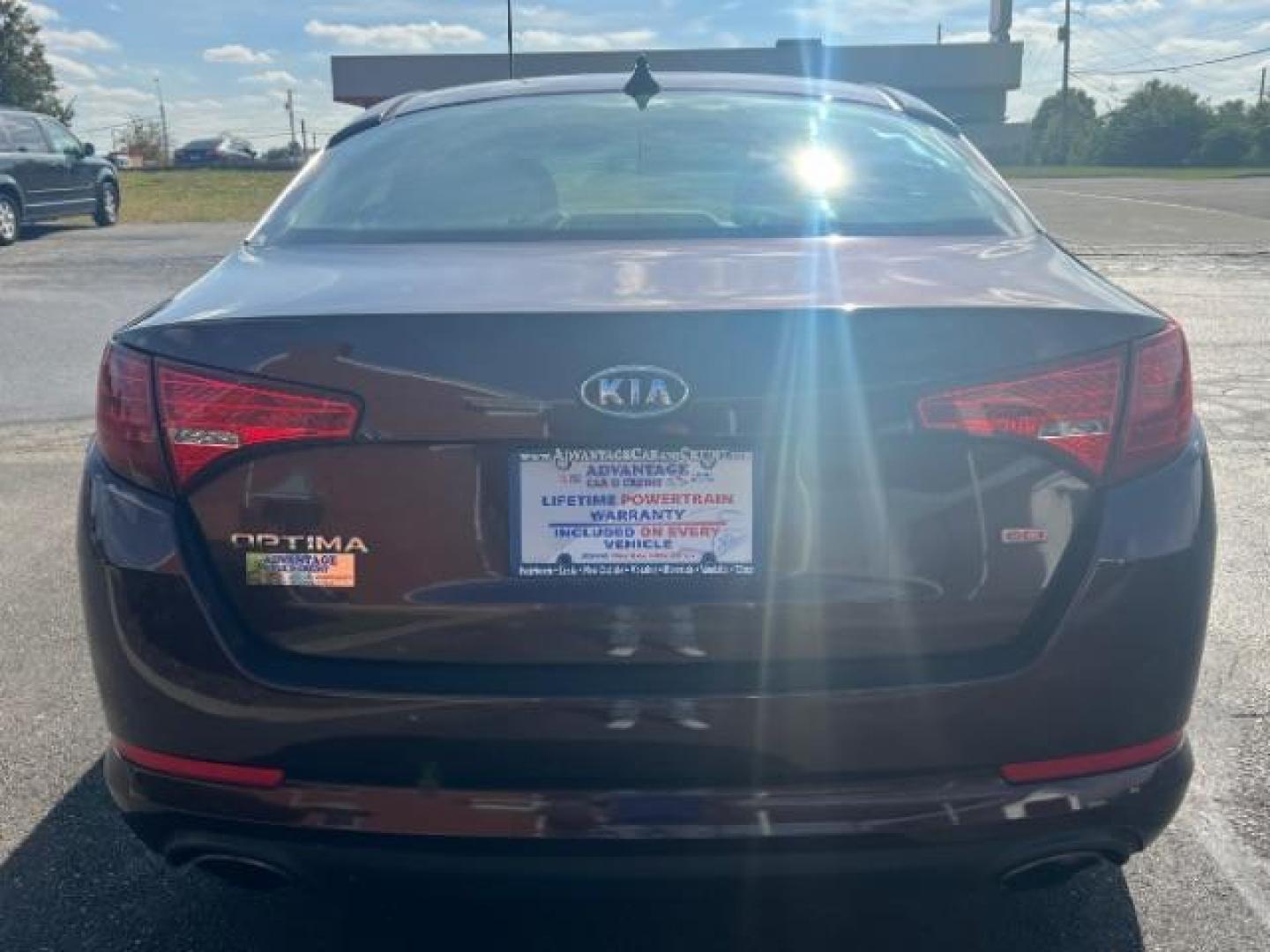 2011 Dark Cherry Kia Optima LX AT (KNAGM4A72B5) with an 2.4L L4 DOHC 16V engine, 6-Speed Automatic transmission, located at 1099 N County Rd 25A, OH, 45373, (937) 908-9800, 40.057079, -84.212883 - Photo#4