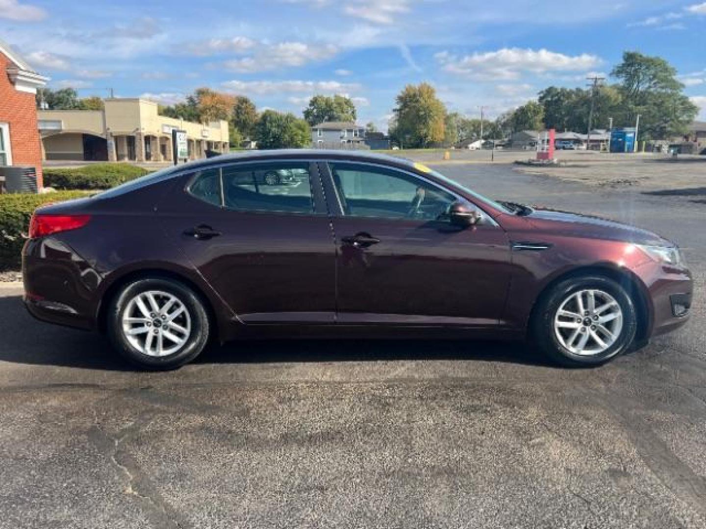 2011 Dark Cherry Kia Optima LX AT (KNAGM4A72B5) with an 2.4L L4 DOHC 16V engine, 6-Speed Automatic transmission, located at 1099 N County Rd 25A, OH, 45373, (937) 908-9800, 40.057079, -84.212883 - Photo#5