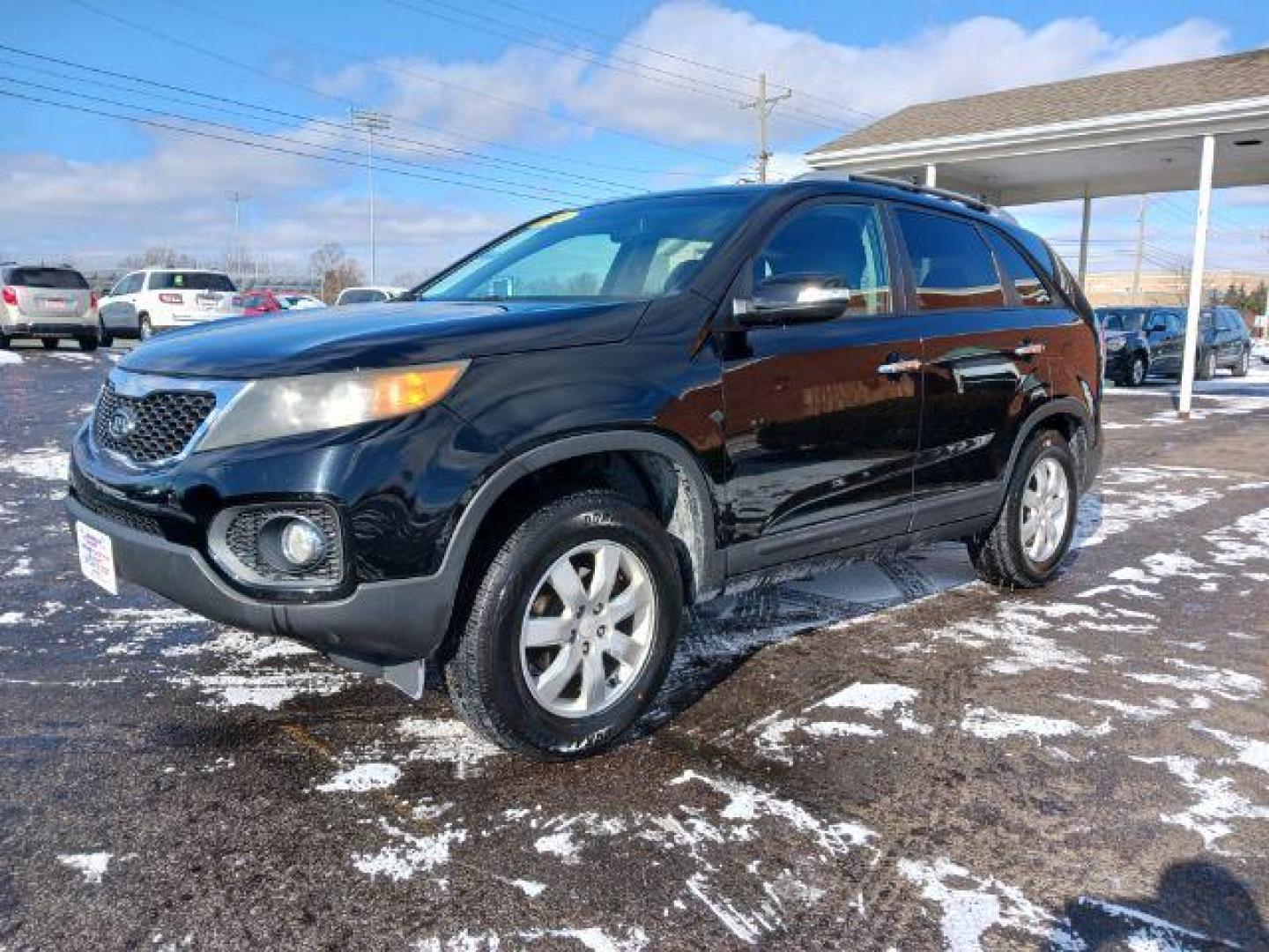 2011 Ebony Black Kia Sorento LX 2WD (5XYKT3A11BG) with an 2.4L L4 DOHC 16V engine, 6-Speed Automatic transmission, located at 1099 N County Rd 25A, OH, 45373, (937) 908-9800, 40.057079, -84.212883 - Photo#2