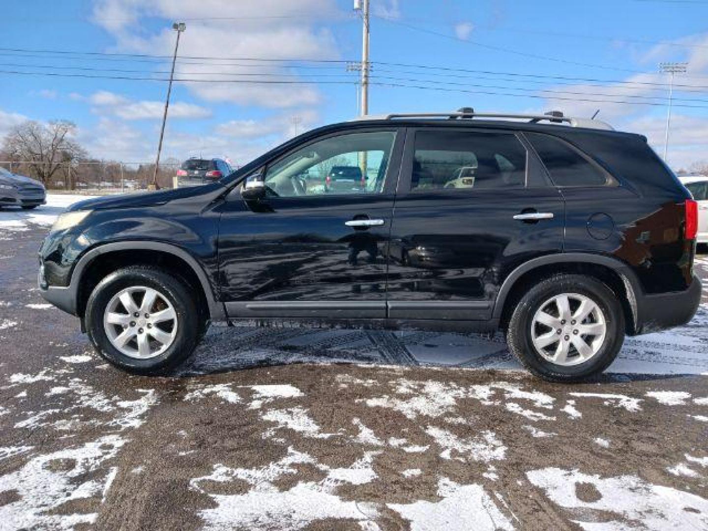 2011 Ebony Black Kia Sorento LX 2WD (5XYKT3A11BG) with an 2.4L L4 DOHC 16V engine, 6-Speed Automatic transmission, located at 1099 N County Rd 25A, OH, 45373, (937) 908-9800, 40.057079, -84.212883 - Photo#3