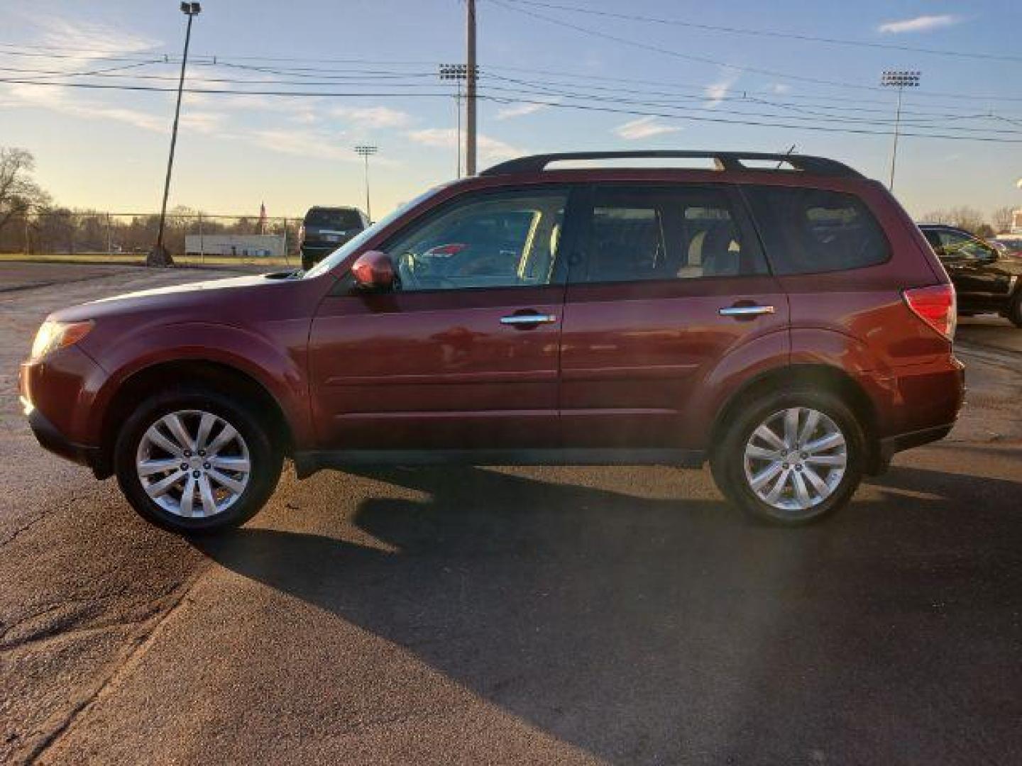 2011 Camellia Red Pearl Subaru Forester 2.5X Limited (JF2SHAEC2BH) with an 2.5L H4 SOHC 16V engine, 4-Speed Automatic transmission, located at 1230 East Main St, Xenia, OH, 45385, (937) 908-9800, 39.687321, -83.910294 - Photo#3