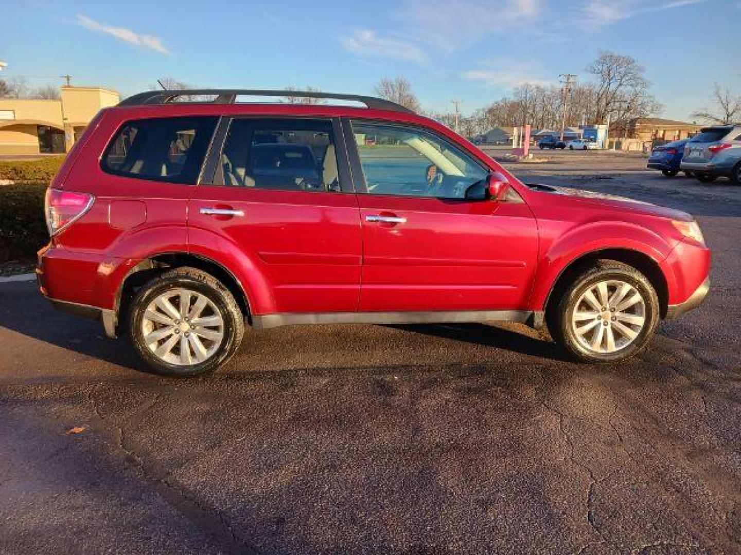 2011 Camellia Red Pearl Subaru Forester 2.5X Limited (JF2SHAEC2BH) with an 2.5L H4 SOHC 16V engine, 4-Speed Automatic transmission, located at 1230 East Main St, Xenia, OH, 45385, (937) 908-9800, 39.687321, -83.910294 - Photo#4