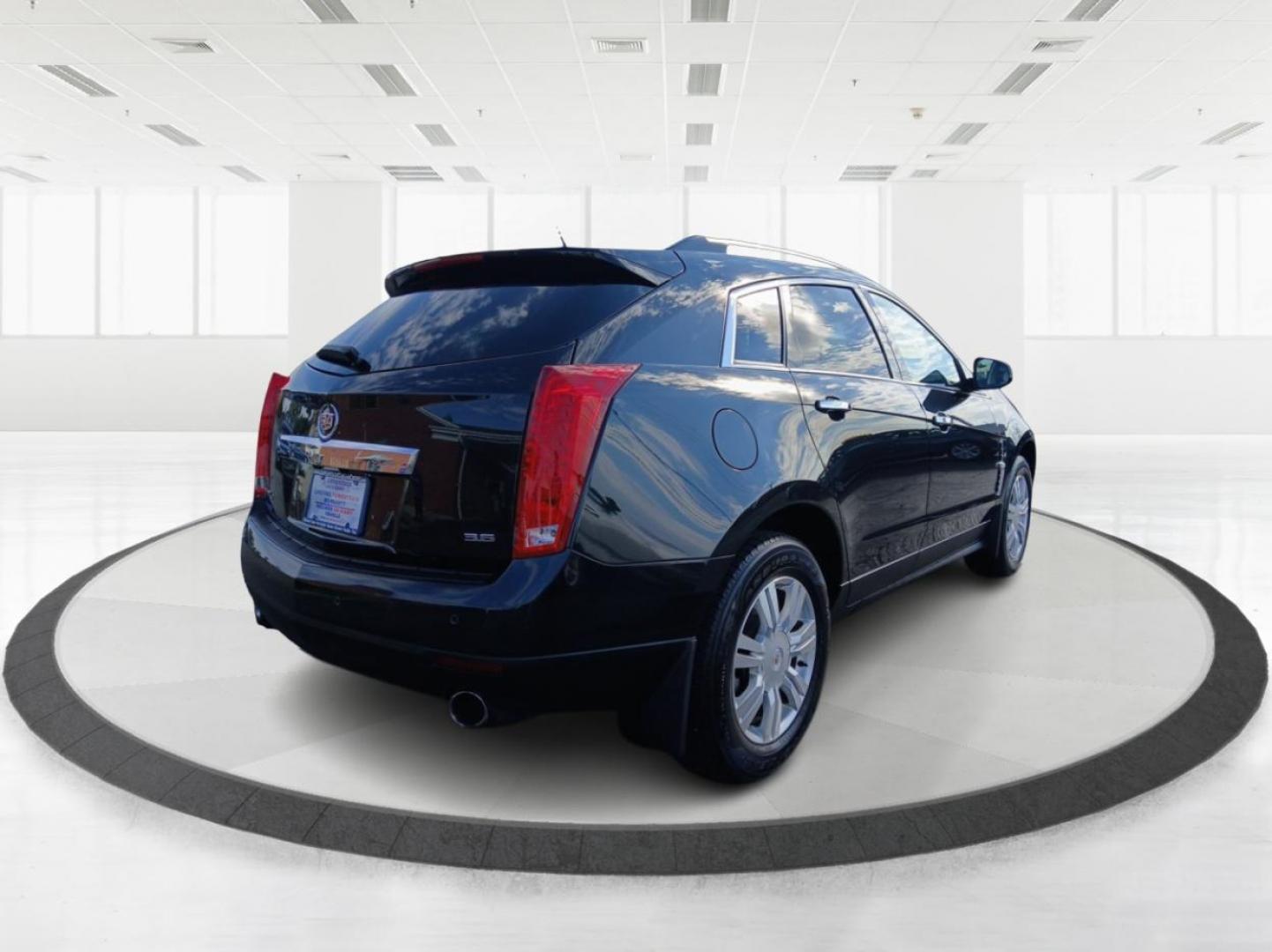 2012 Black Raven Cadillac SRX Luxury AWD (3GYFNDE34CS) with an 3.6L V6 DOHC 24V FFV engine, 6-Speed Automatic transmission, located at 1099 N County Rd 25A, OH, 45373, (937) 908-9800, 40.057079, -84.212883 - Photo#2