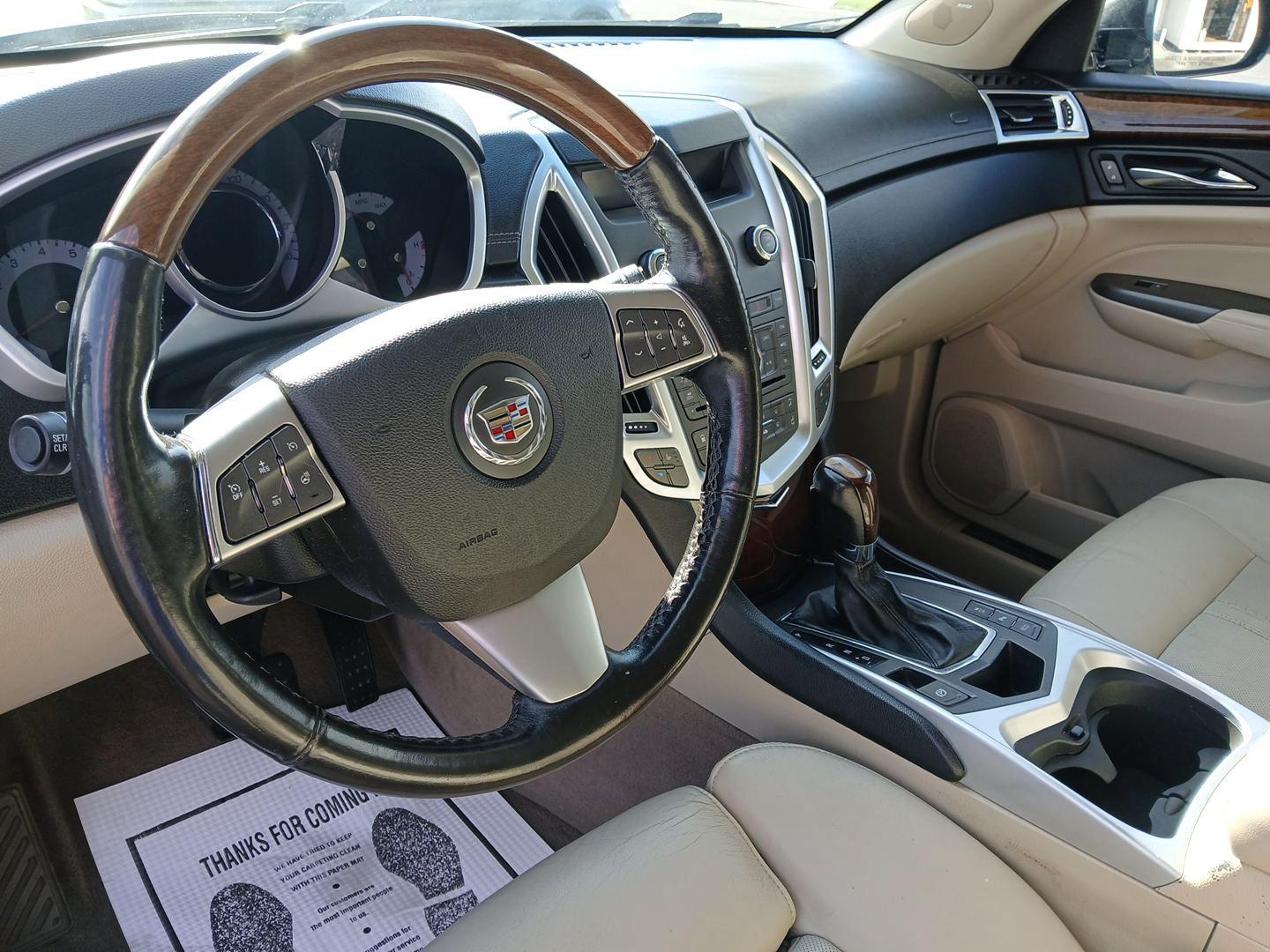 2012 Black Raven Cadillac SRX Luxury AWD (3GYFNDE34CS) with an 3.6L V6 DOHC 24V FFV engine, 6-Speed Automatic transmission, located at 1099 N County Rd 25A, OH, 45373, (937) 908-9800, 40.057079, -84.212883 - Photo#8