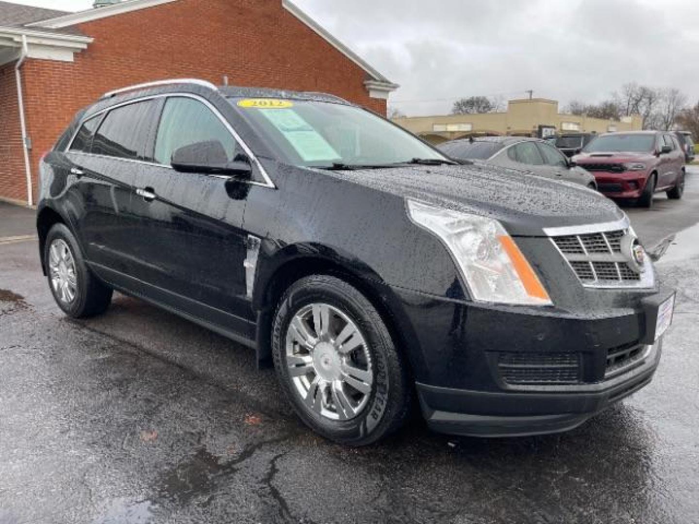 2012 Black Raven Cadillac SRX Luxury AWD (3GYFNDE35CS) with an 3.6L V6 DOHC 24V FFV engine, 6-Speed Automatic transmission, located at 1951 S Dayton Lakeview Rd., New Carlisle, OH, 45344, (937) 908-9800, 39.890999, -84.050255 - Photo#0