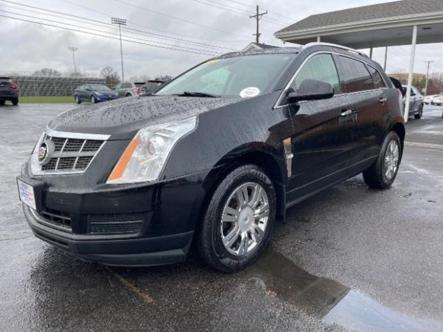 2012 Black Raven Cadillac SRX Luxury AWD (3GYFNDE35CS) with an 3.6L V6 DOHC 24V FFV engine, 6-Speed Automatic transmission, located at 1951 S Dayton Lakeview Rd., New Carlisle, OH, 45344, (937) 908-9800, 39.890999, -84.050255 - Photo#1