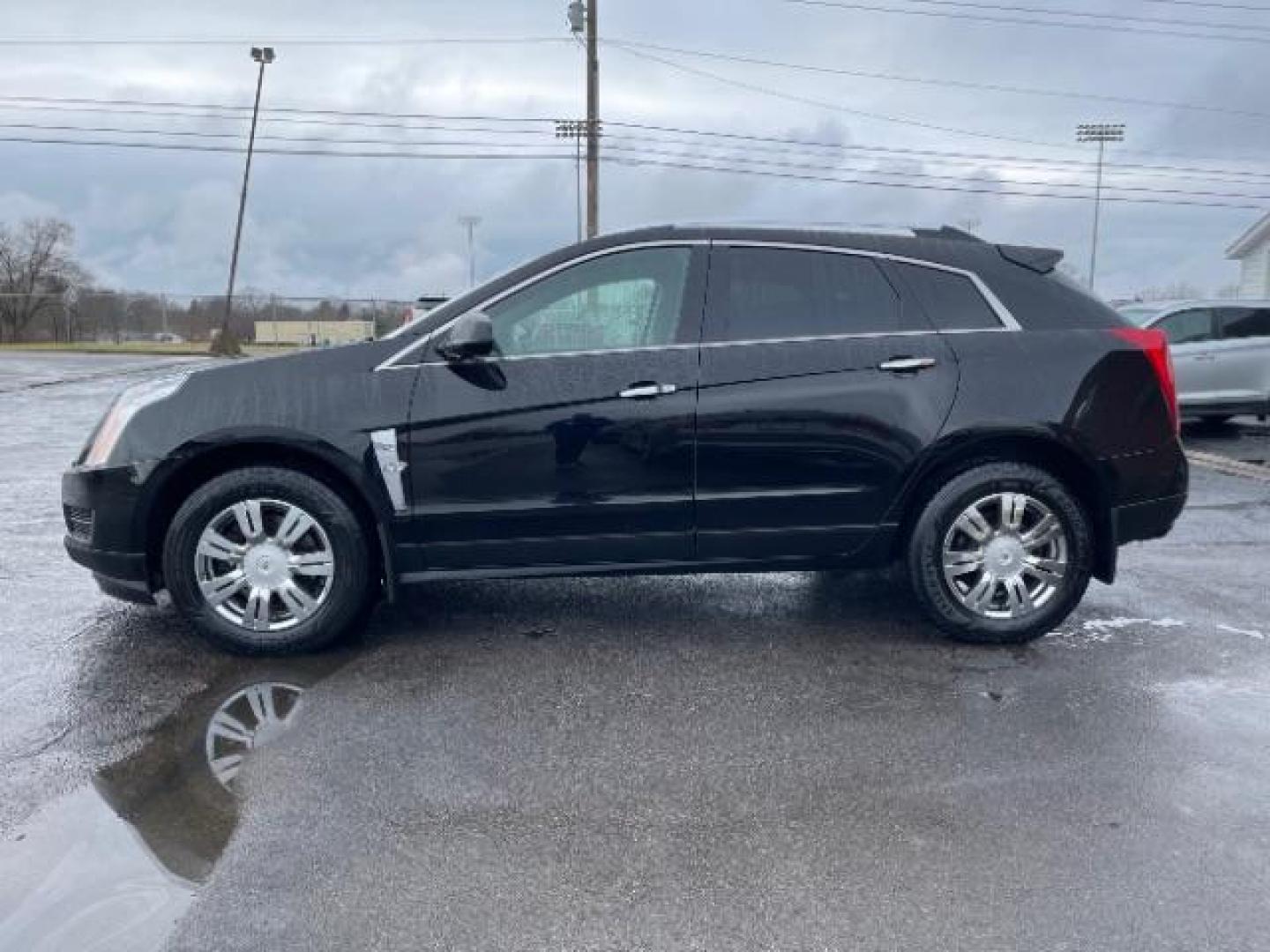 2012 Black Raven Cadillac SRX Luxury AWD (3GYFNDE35CS) with an 3.6L V6 DOHC 24V FFV engine, 6-Speed Automatic transmission, located at 1951 S Dayton Lakeview Rd., New Carlisle, OH, 45344, (937) 908-9800, 39.890999, -84.050255 - Photo#2