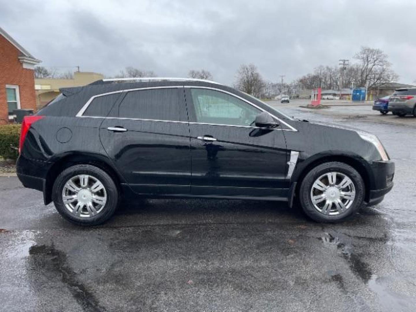 2012 Black Raven Cadillac SRX Luxury AWD (3GYFNDE35CS) with an 3.6L V6 DOHC 24V FFV engine, 6-Speed Automatic transmission, located at 1951 S Dayton Lakeview Rd., New Carlisle, OH, 45344, (937) 908-9800, 39.890999, -84.050255 - Photo#3