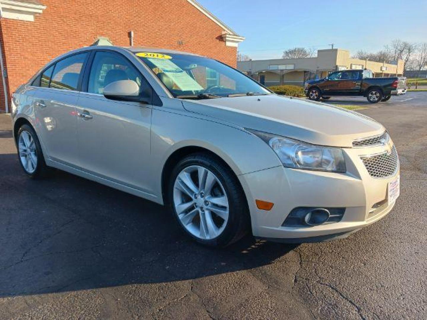 2012 Gold Mist Metallic Chevrolet Cruze LTZ (1G1PH5SC3C7) with an 1.4L L4 DOHC 16V TURBO engine, 6-Speed Automatic transmission, located at 880 E. National Road, Vandalia, OH, 45377, (937) 908-9800, 39.892189, -84.181015 - Photo#0