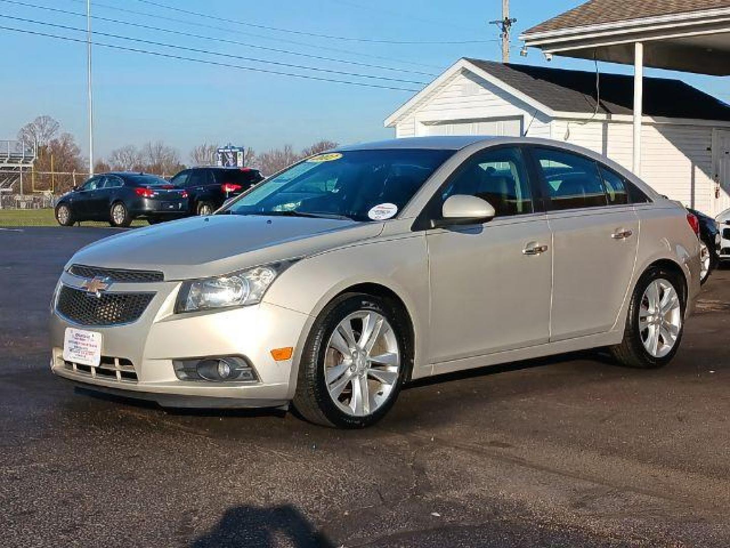 2012 Gold Mist Metallic Chevrolet Cruze LTZ (1G1PH5SC3C7) with an 1.4L L4 DOHC 16V TURBO engine, 6-Speed Automatic transmission, located at 880 E. National Road, Vandalia, OH, 45377, (937) 908-9800, 39.892189, -84.181015 - Photo#2