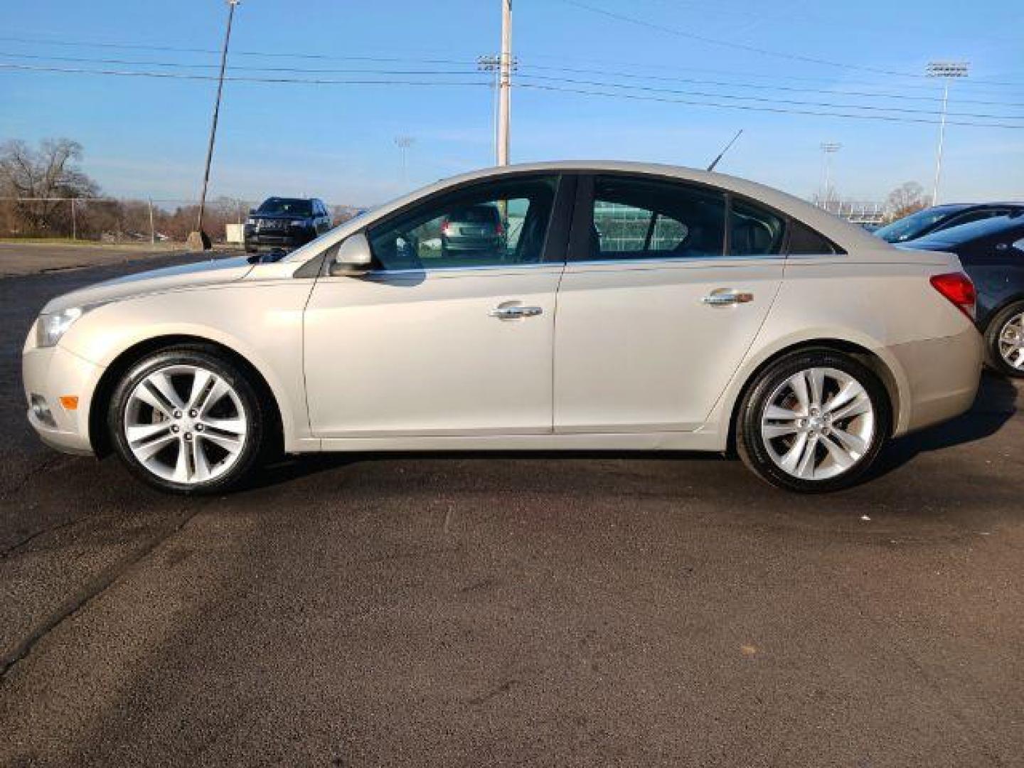 2012 Gold Mist Metallic Chevrolet Cruze LTZ (1G1PH5SC3C7) with an 1.4L L4 DOHC 16V TURBO engine, 6-Speed Automatic transmission, located at 880 E. National Road, Vandalia, OH, 45377, (937) 908-9800, 39.892189, -84.181015 - Photo#3