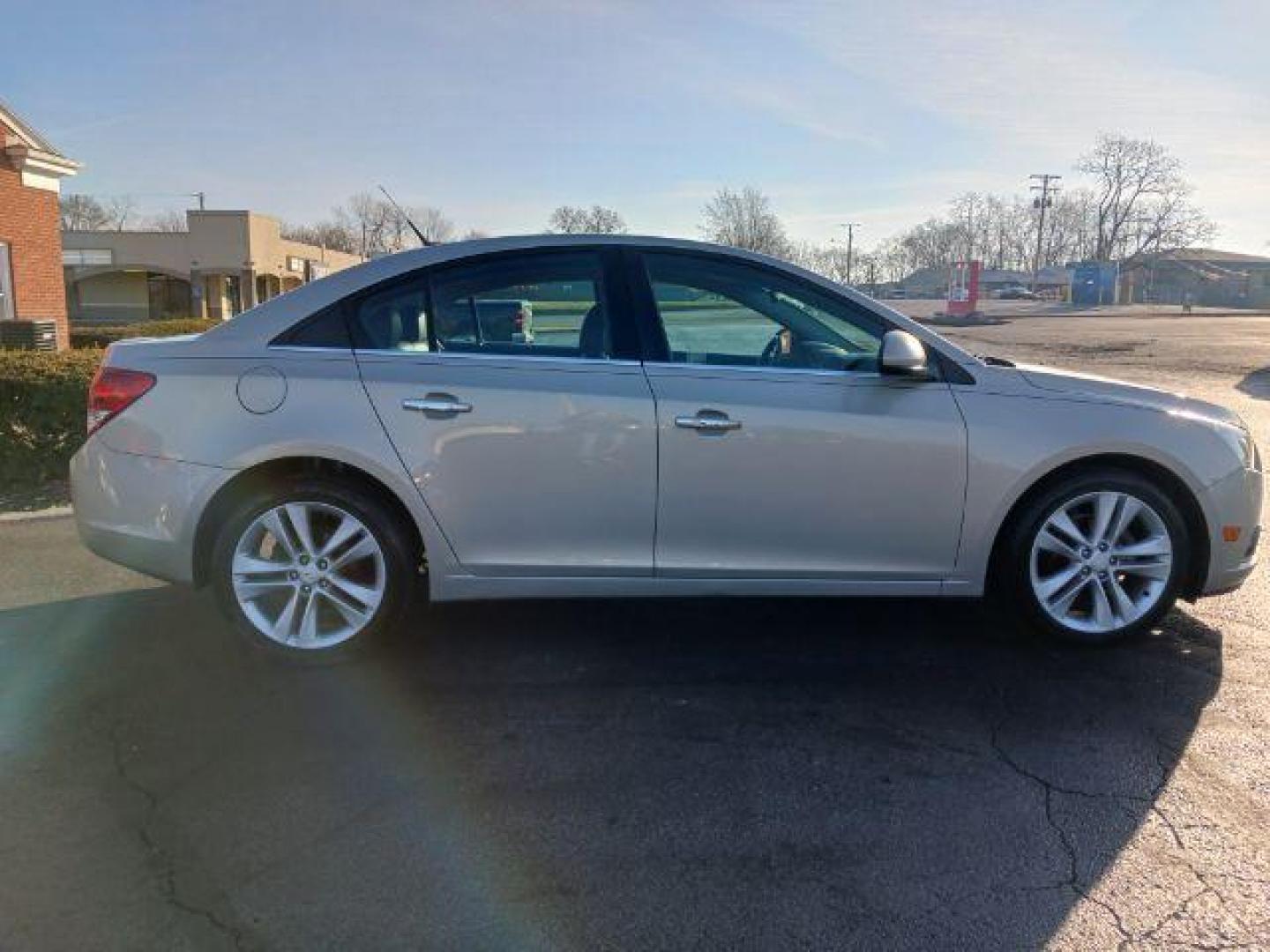 2012 Gold Mist Metallic Chevrolet Cruze LTZ (1G1PH5SC3C7) with an 1.4L L4 DOHC 16V TURBO engine, 6-Speed Automatic transmission, located at 880 E. National Road, Vandalia, OH, 45377, (937) 908-9800, 39.892189, -84.181015 - Photo#4