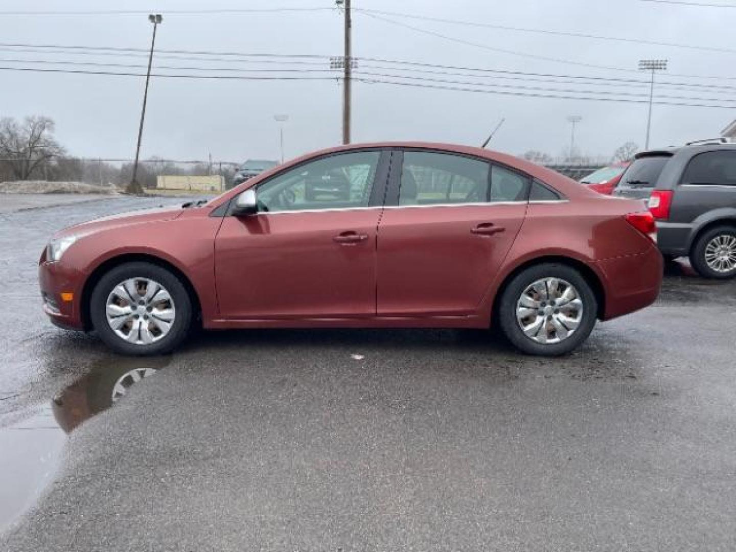 2012 Orange Chevrolet Cruze 2LS (1G1PC5SH1C7) with an 1.8L L4 DOHC 16V FFV engine, 6-Speed Automatic transmission, located at 880 E. National Road, Vandalia, OH, 45377, (937) 908-9800, 39.892189, -84.181015 - Photo#4