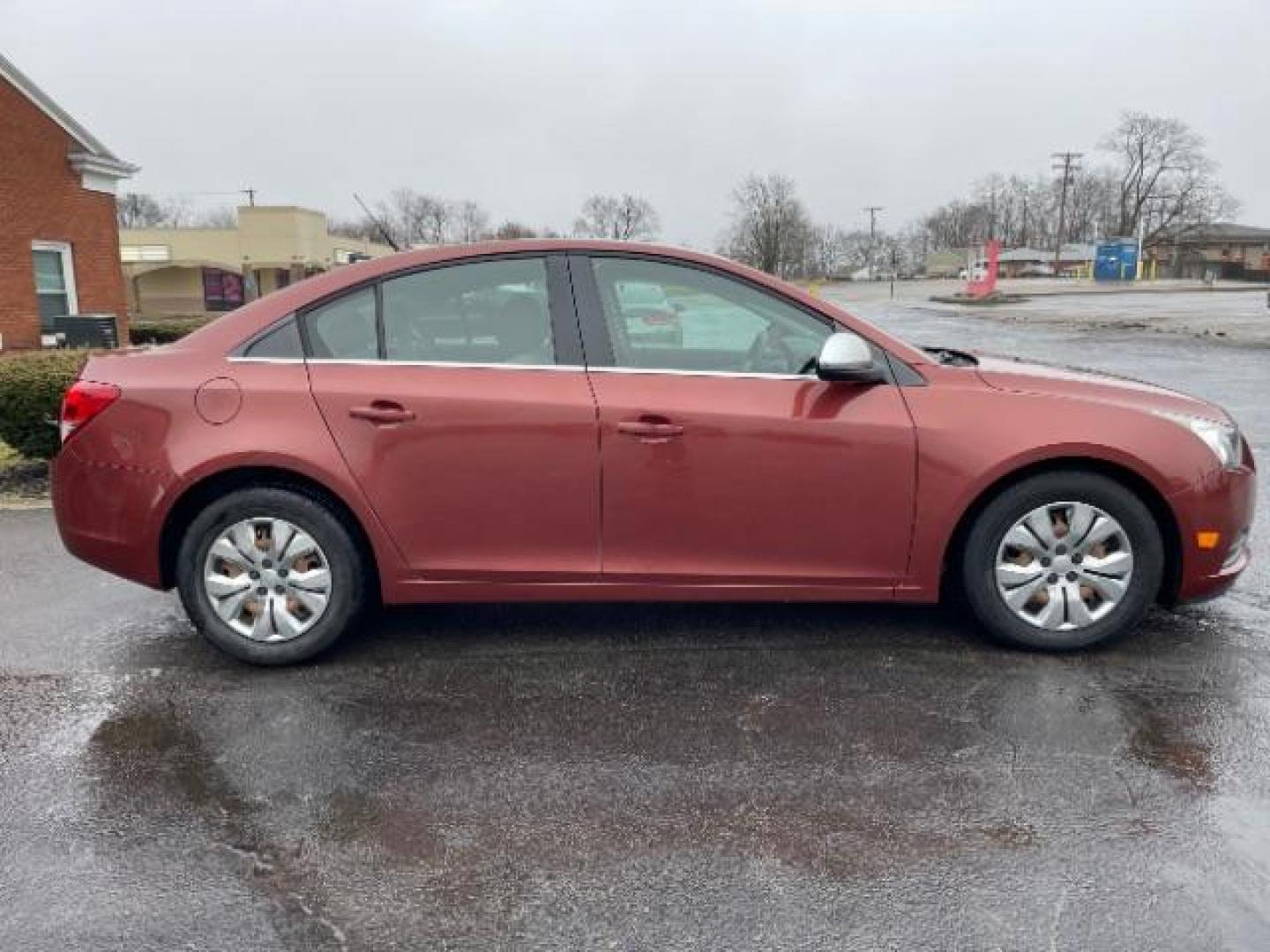 2012 Orange Chevrolet Cruze 2LS (1G1PC5SH1C7) with an 1.8L L4 DOHC 16V FFV engine, 6-Speed Automatic transmission, located at 880 E. National Road, Vandalia, OH, 45377, (937) 908-9800, 39.892189, -84.181015 - Photo#5