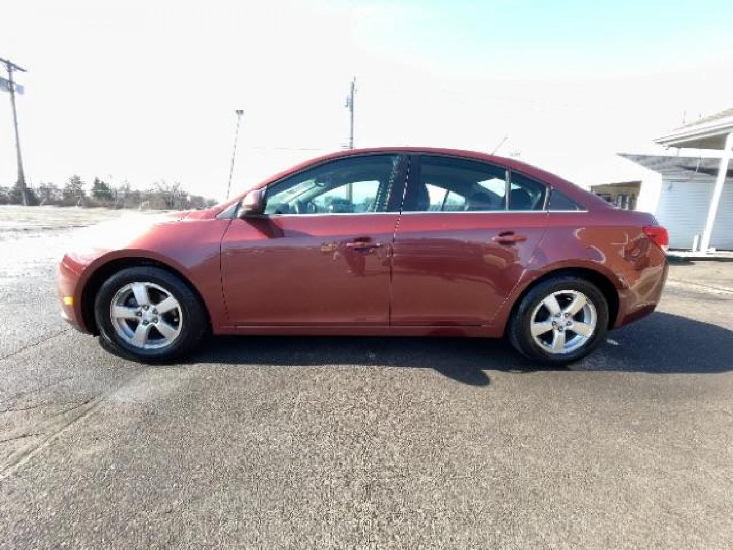 2012 Orange Chevrolet Cruze 1LT (1G1PF5SC6C7) with an 1.4L L4 DOHC 16V TURBO engine, 6-Speed Automatic transmission, located at 880 E. National Road, Vandalia, OH, 45377, (937) 908-9800, 39.892189, -84.181015 - Photo#2