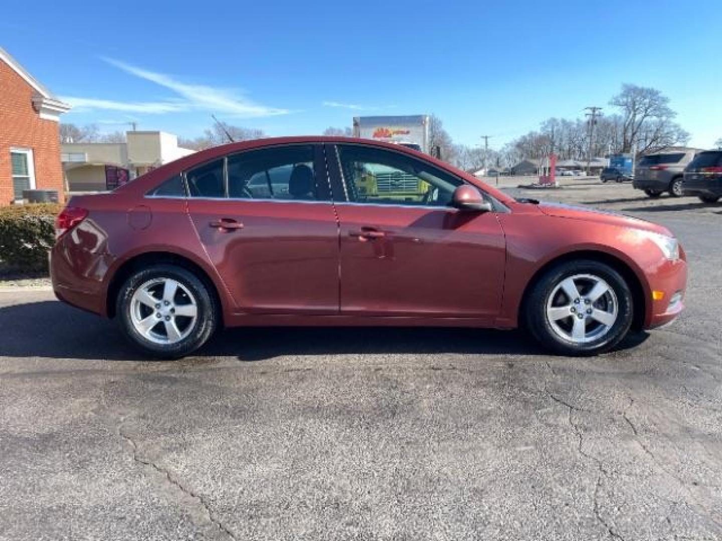 2012 Orange Chevrolet Cruze 1LT (1G1PF5SC6C7) with an 1.4L L4 DOHC 16V TURBO engine, 6-Speed Automatic transmission, located at 880 E. National Road, Vandalia, OH, 45377, (937) 908-9800, 39.892189, -84.181015 - Photo#3