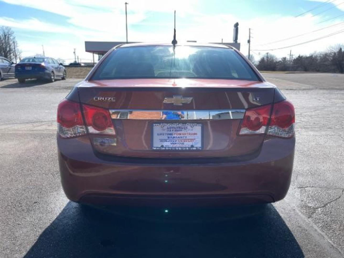 2012 Orange Chevrolet Cruze 1LT (1G1PF5SC6C7) with an 1.4L L4 DOHC 16V TURBO engine, 6-Speed Automatic transmission, located at 880 E. National Road, Vandalia, OH, 45377, (937) 908-9800, 39.892189, -84.181015 - Photo#5