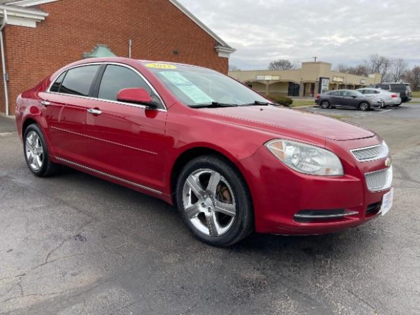 2012 Red Chevrolet Malibu 1LT (1G1ZC5E0XCF) with an 2.4L L4 DOHC 16V engine, 6-Speed Automatic transmission, located at 401 Woodman Dr, Riverside, OH, 45431, (937) 908-9800, 39.763779, -84.122063 - Photo#0