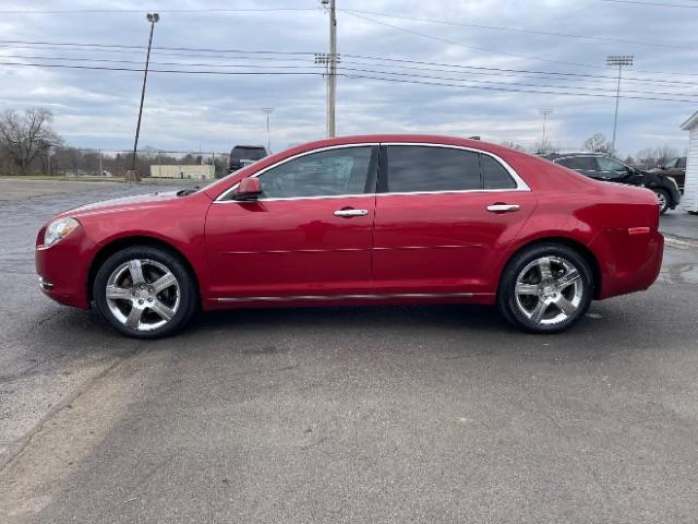 2012 Red Chevrolet Malibu 1LT (1G1ZC5E0XCF) with an 2.4L L4 DOHC 16V engine, 6-Speed Automatic transmission, located at 401 Woodman Dr, Riverside, OH, 45431, (937) 908-9800, 39.763779, -84.122063 - Photo#2