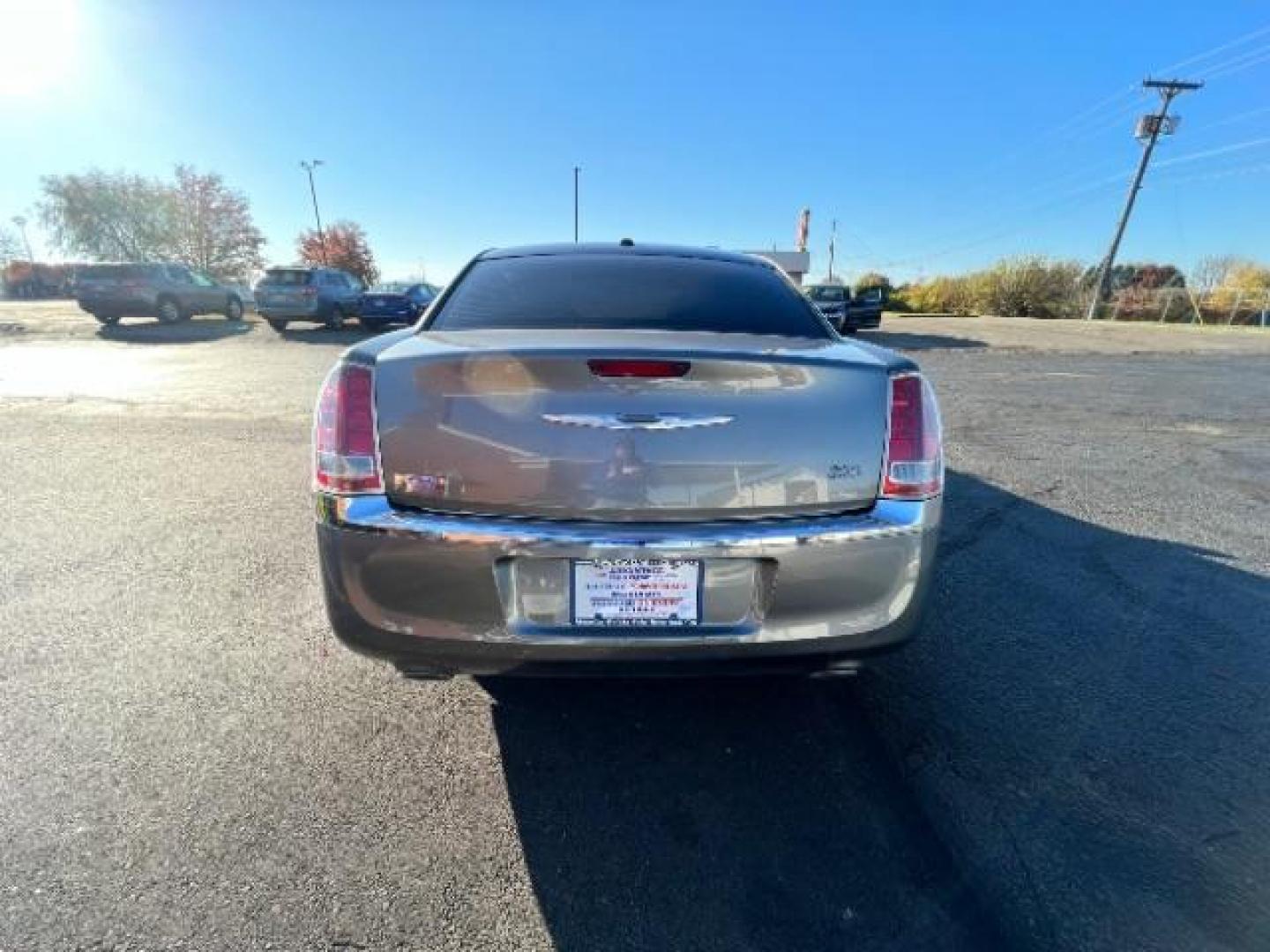 2012 Tungsten Metallic Chrysler 300 Base (2C3CCAAG9CH) with an 3.6L V6 SOHC 24V engine, 5-Speed Automatic transmission, located at 880 E. National Road, Vandalia, OH, 45377, (937) 908-9800, 39.892189, -84.181015 - Photo#4