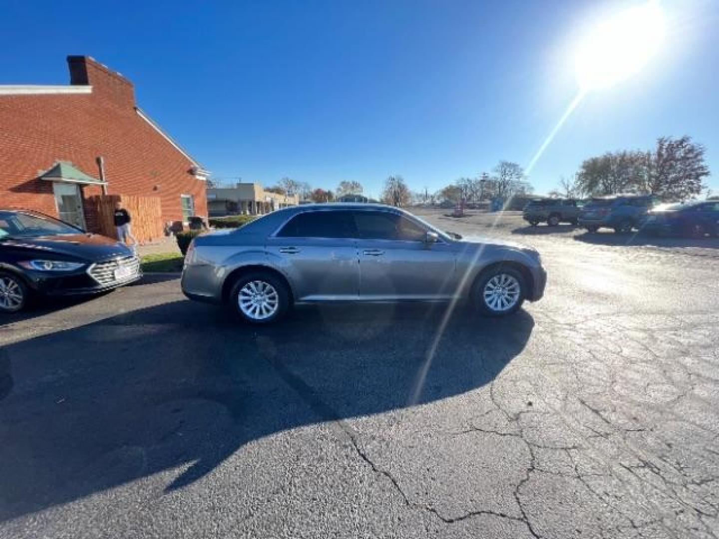 2012 Tungsten Metallic Chrysler 300 Base (2C3CCAAG9CH) with an 3.6L V6 SOHC 24V engine, 5-Speed Automatic transmission, located at 880 E. National Road, Vandalia, OH, 45377, (937) 908-9800, 39.892189, -84.181015 - Photo#5