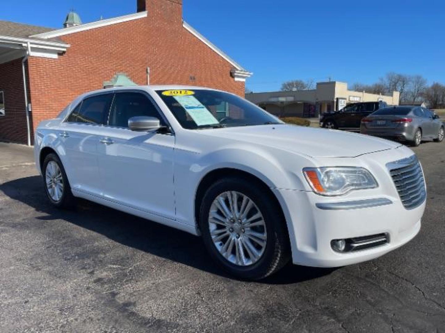 2012 Bright White Chrysler 300 C AWD (2C3CCAST7CH) with an 5.7L V8 OHV 16V engine, 5-Speed Automatic transmission, located at 1099 N County Rd 25A, OH, 45373, (937) 908-9800, 40.057079, -84.212883 - Photo#0