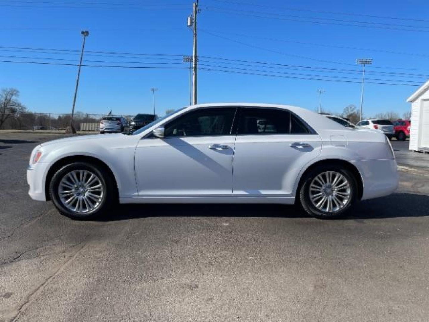 2012 Bright White Chrysler 300 C AWD (2C3CCAST7CH) with an 5.7L V8 OHV 16V engine, 5-Speed Automatic transmission, located at 1099 N County Rd 25A, OH, 45373, (937) 908-9800, 40.057079, -84.212883 - Photo#2