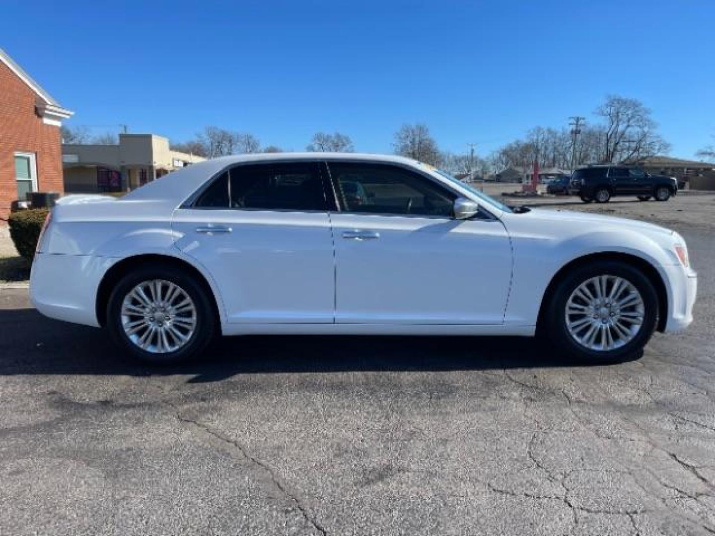 2012 Bright White Chrysler 300 C AWD (2C3CCAST7CH) with an 5.7L V8 OHV 16V engine, 5-Speed Automatic transmission, located at 1099 N County Rd 25A, OH, 45373, (937) 908-9800, 40.057079, -84.212883 - Photo#3