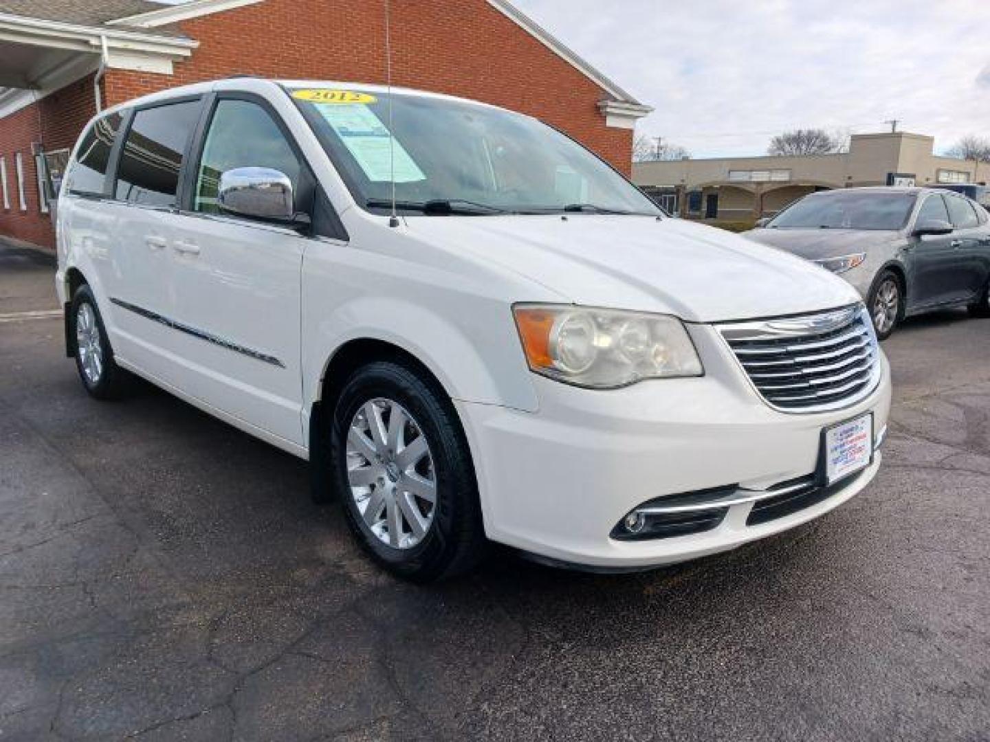 2012 Stone White Chrysler Town and Country Touring-L (2C4RC1CG4CR) with an 3.6L V6 DOHC 24V engine, 6-Speed Automatic transmission, located at 1184 Kauffman Ave, Fairborn, OH, 45324, (937) 908-9800, 39.807365, -84.029114 - Photo#0