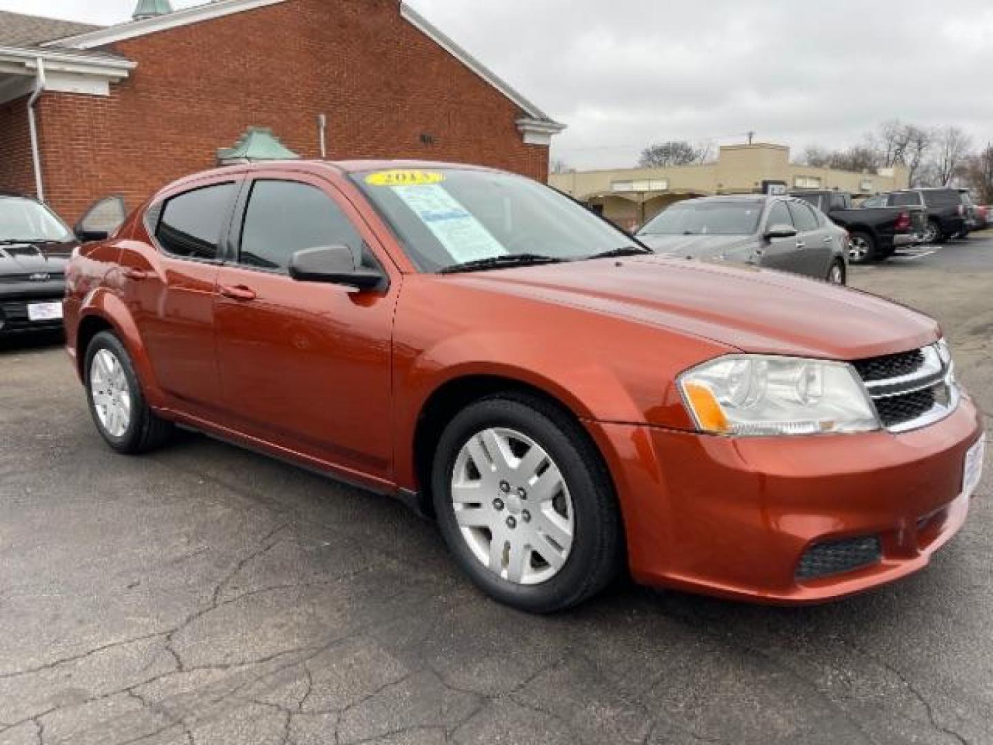 2012 Orange Dodge Avenger Base (1C3CDZAB1CN) with an 2.4L L4 DOHC 16V engine, 4-Speed Automatic transmission, located at 880 E. National Road, Vandalia, OH, 45377, (937) 908-9800, 39.892189, -84.181015 - Photo#0