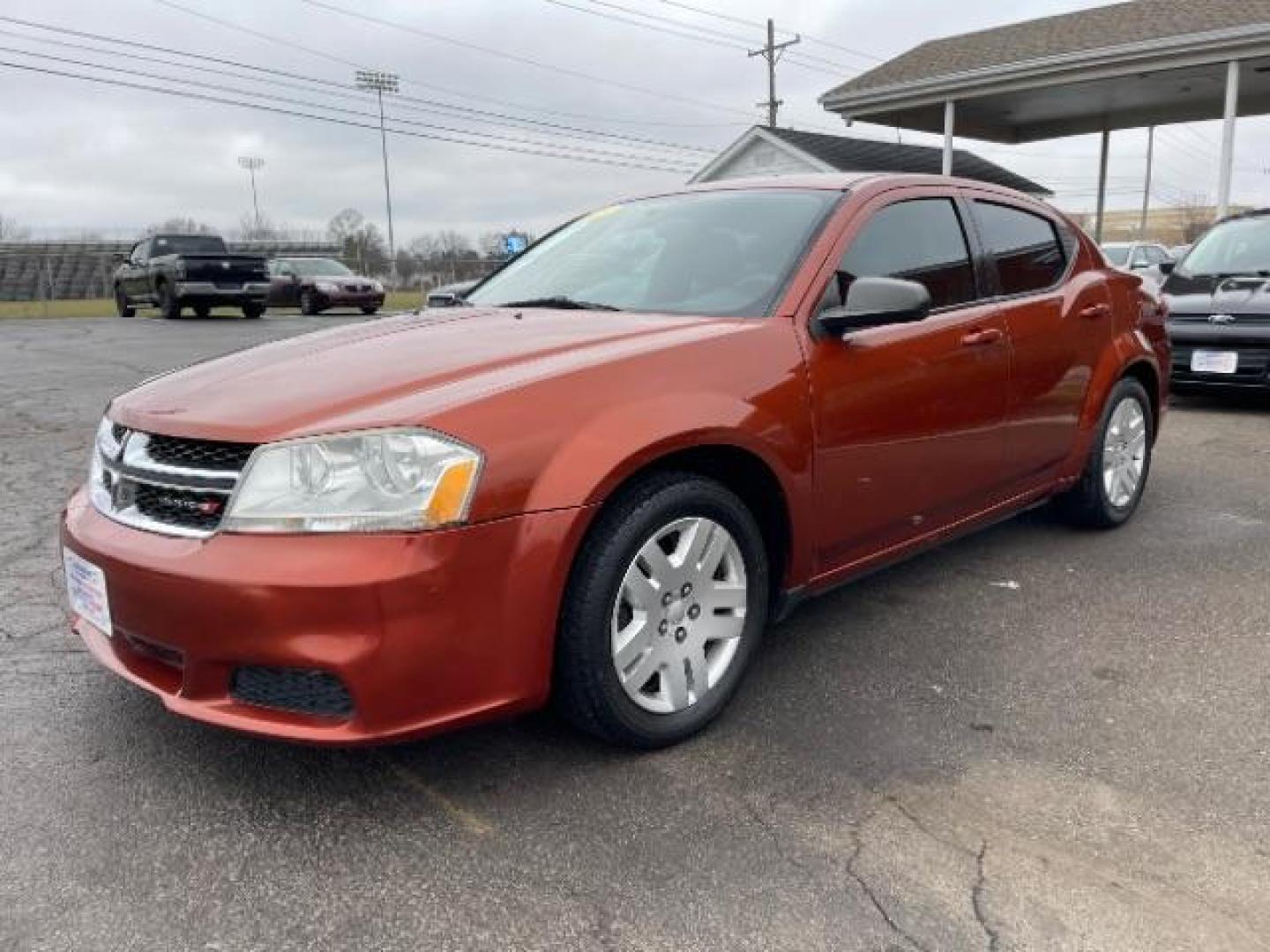 2012 Orange Dodge Avenger Base (1C3CDZAB1CN) with an 2.4L L4 DOHC 16V engine, 4-Speed Automatic transmission, located at 880 E. National Road, Vandalia, OH, 45377, (937) 908-9800, 39.892189, -84.181015 - Photo#1