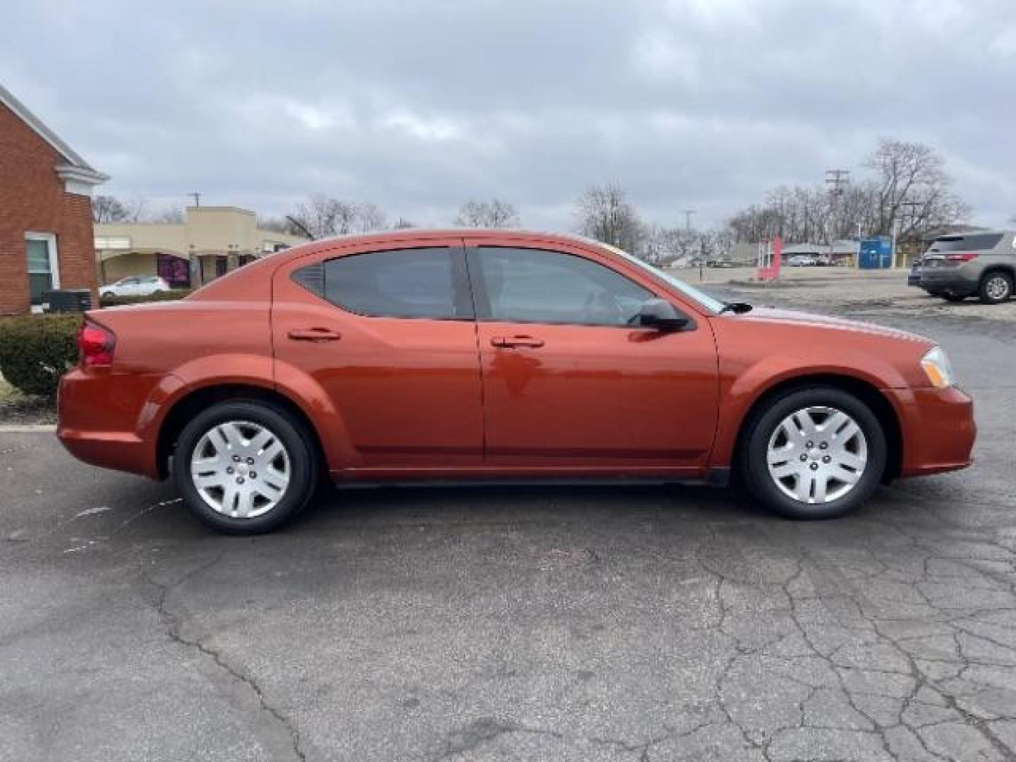 2012 Orange Dodge Avenger Base (1C3CDZAB1CN) with an 2.4L L4 DOHC 16V engine, 4-Speed Automatic transmission, located at 880 E. National Road, Vandalia, OH, 45377, (937) 908-9800, 39.892189, -84.181015 - Photo#3