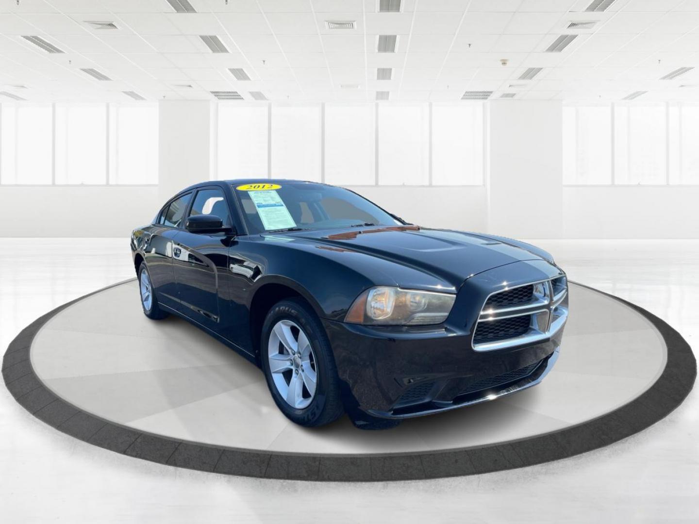 2012 Pitch Black Dodge Charger SE (2C3CDXBGXCH) with an 3.6L V6 DOHC 24V engine, 5-Speed Automatic transmission, located at 1099 N County Rd 25A, OH, 45373, (937) 908-9800, 40.057079, -84.212883 - Photo#0