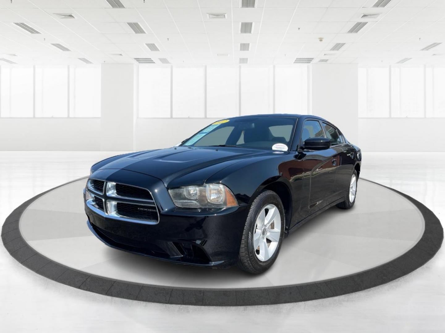 2012 Pitch Black Dodge Charger SE (2C3CDXBGXCH) with an 3.6L V6 DOHC 24V engine, 5-Speed Automatic transmission, located at 1099 N County Rd 25A, OH, 45373, (937) 908-9800, 40.057079, -84.212883 - Photo#7